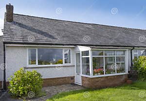 UK 60 s Bungalow With Slate Roof White Quartz Render And Upvc Double 