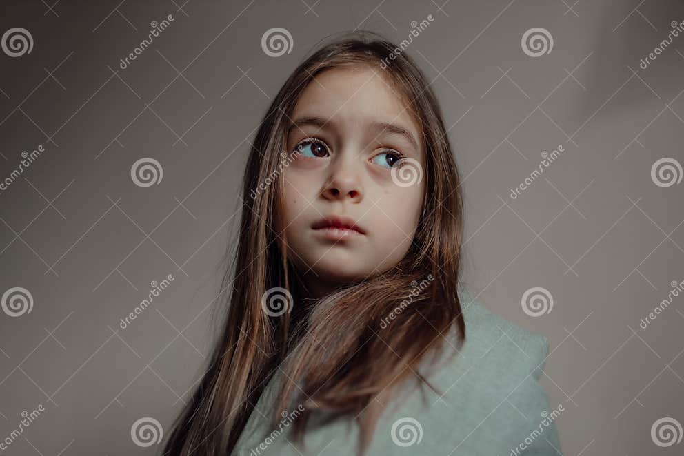 Ukrainian Frightened Child Under a Blanket. Stop War. Stock Image