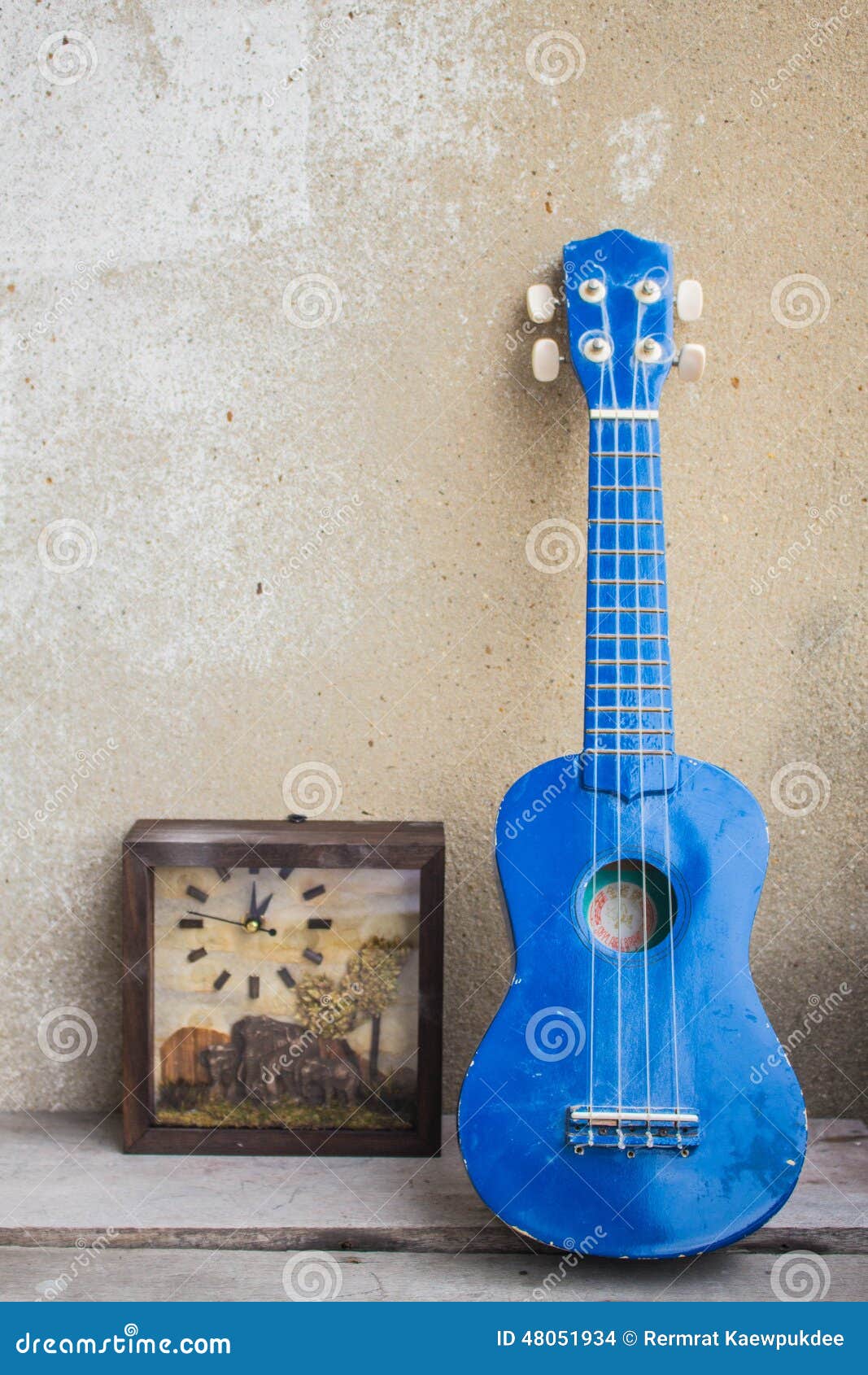 Ukulele against the wall. stock photo. Image of elegance 48051934