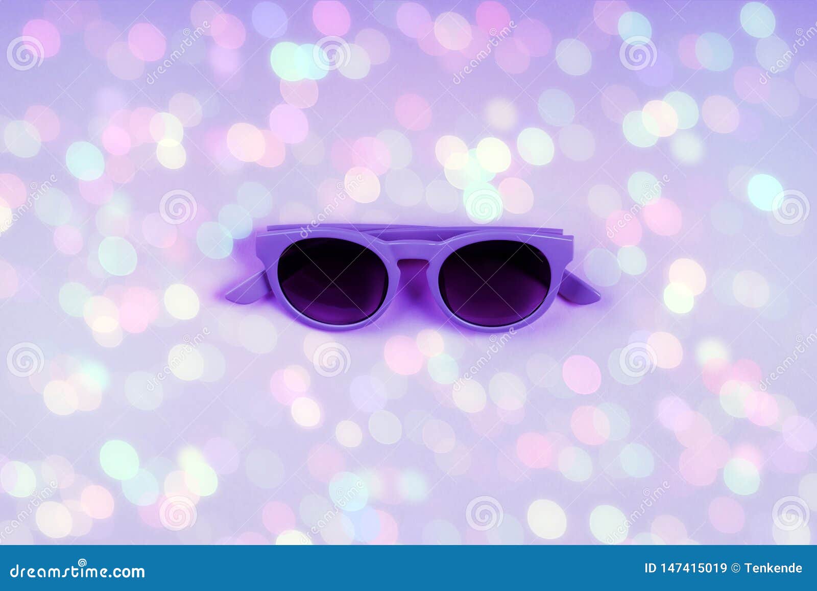 Ultra Violet Sun Glasses on Backdrop with Bokeh Stock Image - Image of ...