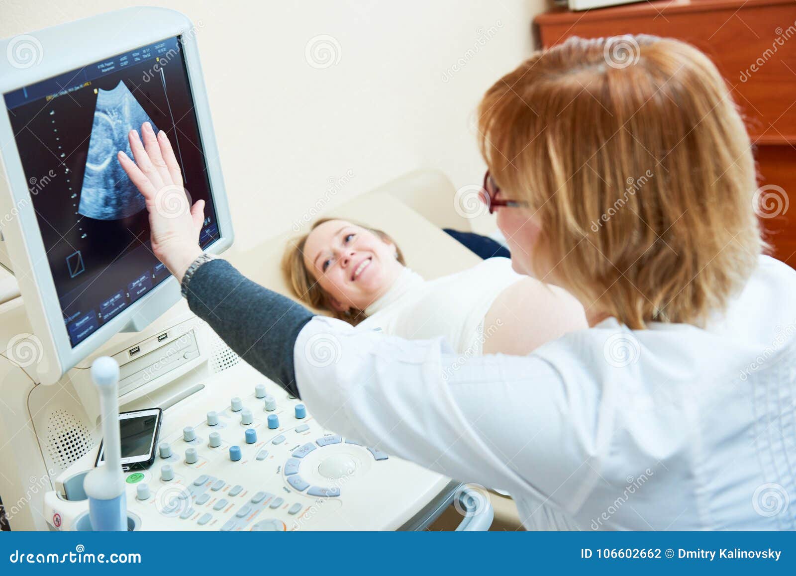 ultrasound test. pregnancy. gynecologist checking fetal life with scanner.