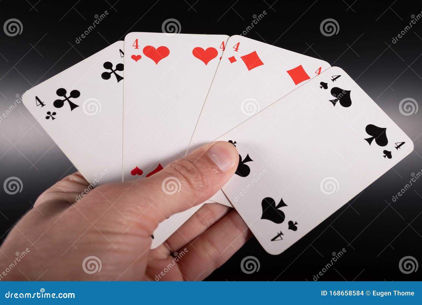 Uma Mão Com Cartas De Jogar Foto de Stock - Imagem de burro