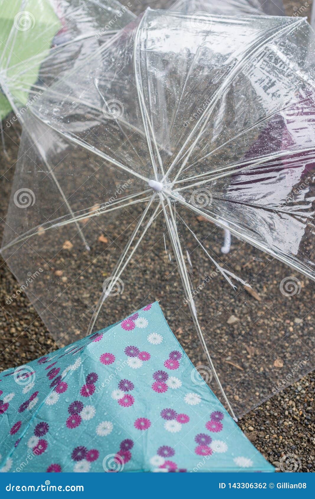 Umbrellas on the ground stock photo. Image of plastic 143306362
