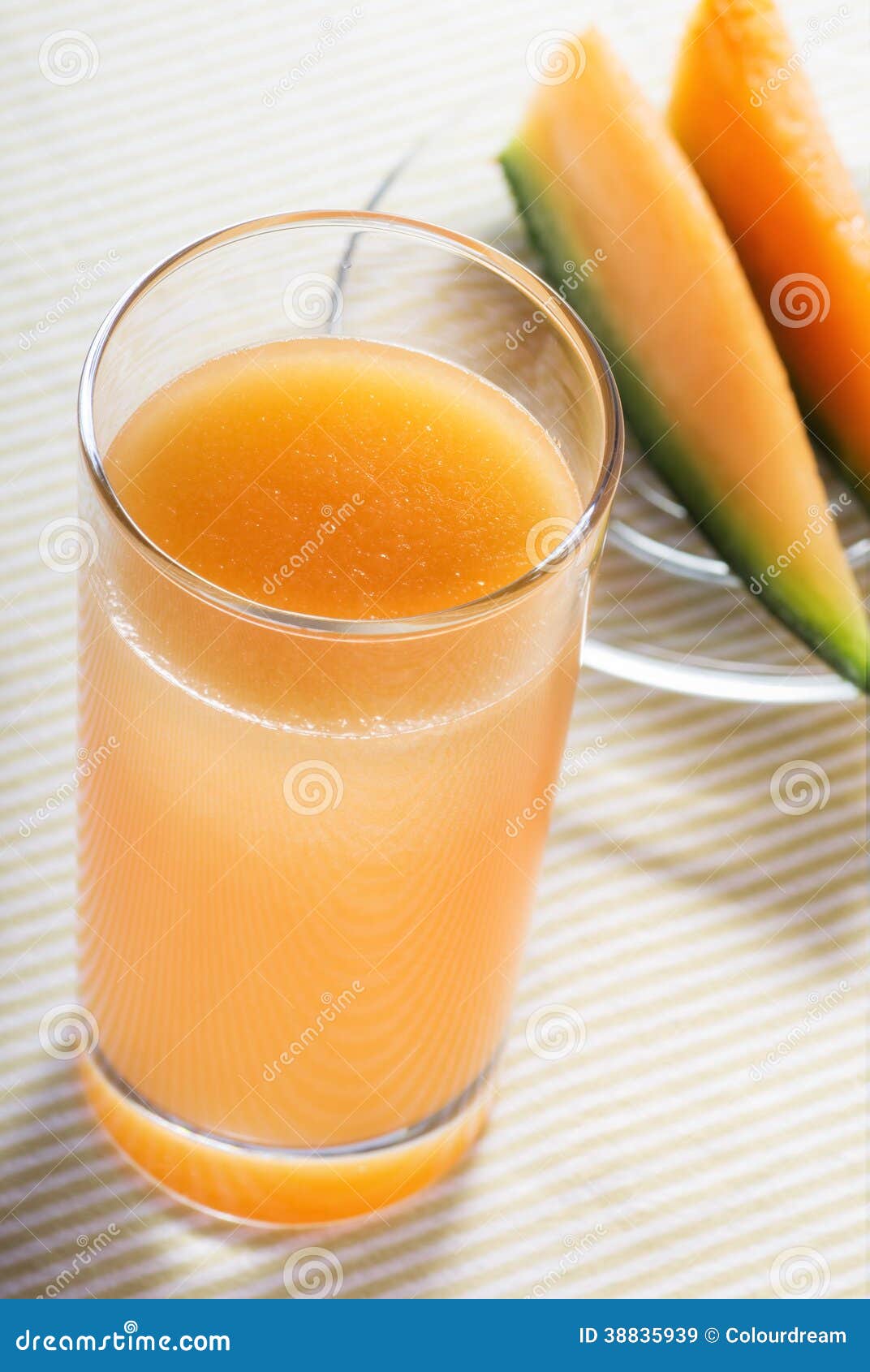 Un Vidrio De Jugo Del Melón Imagen de archivo Imagen de anaranjado