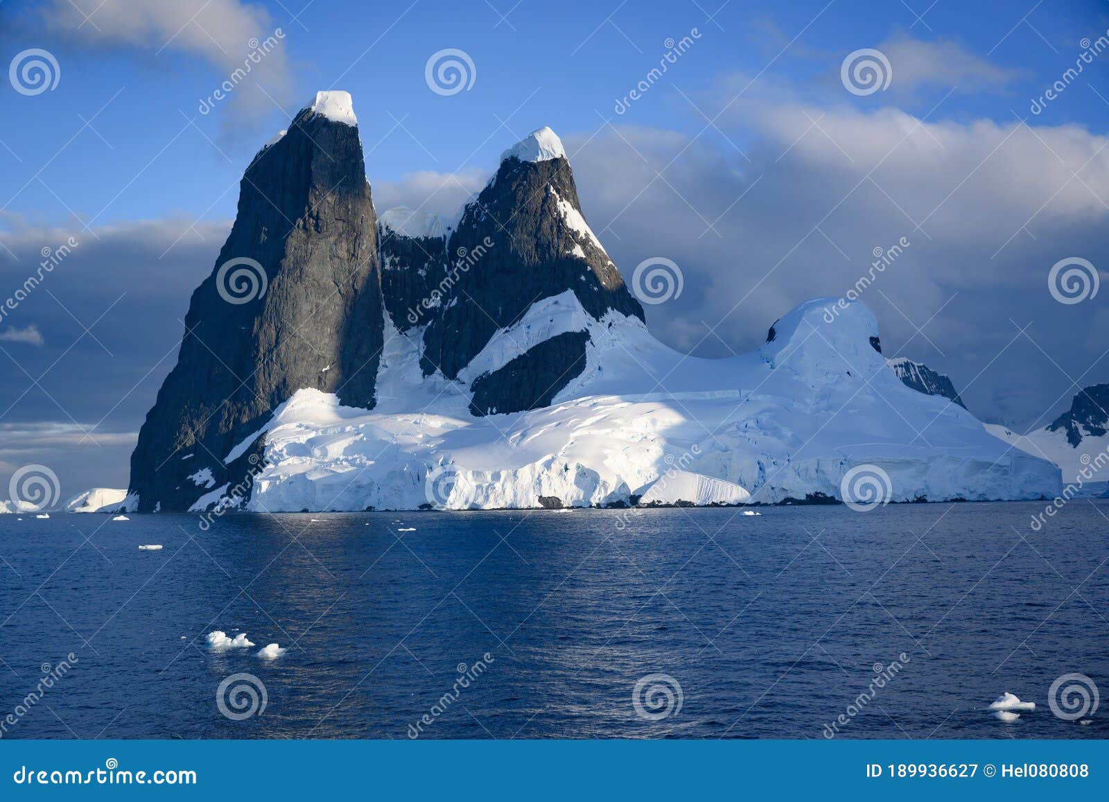 una peaks, two towers of basalt on the entrance to lemaire channel , antarctic peninsula