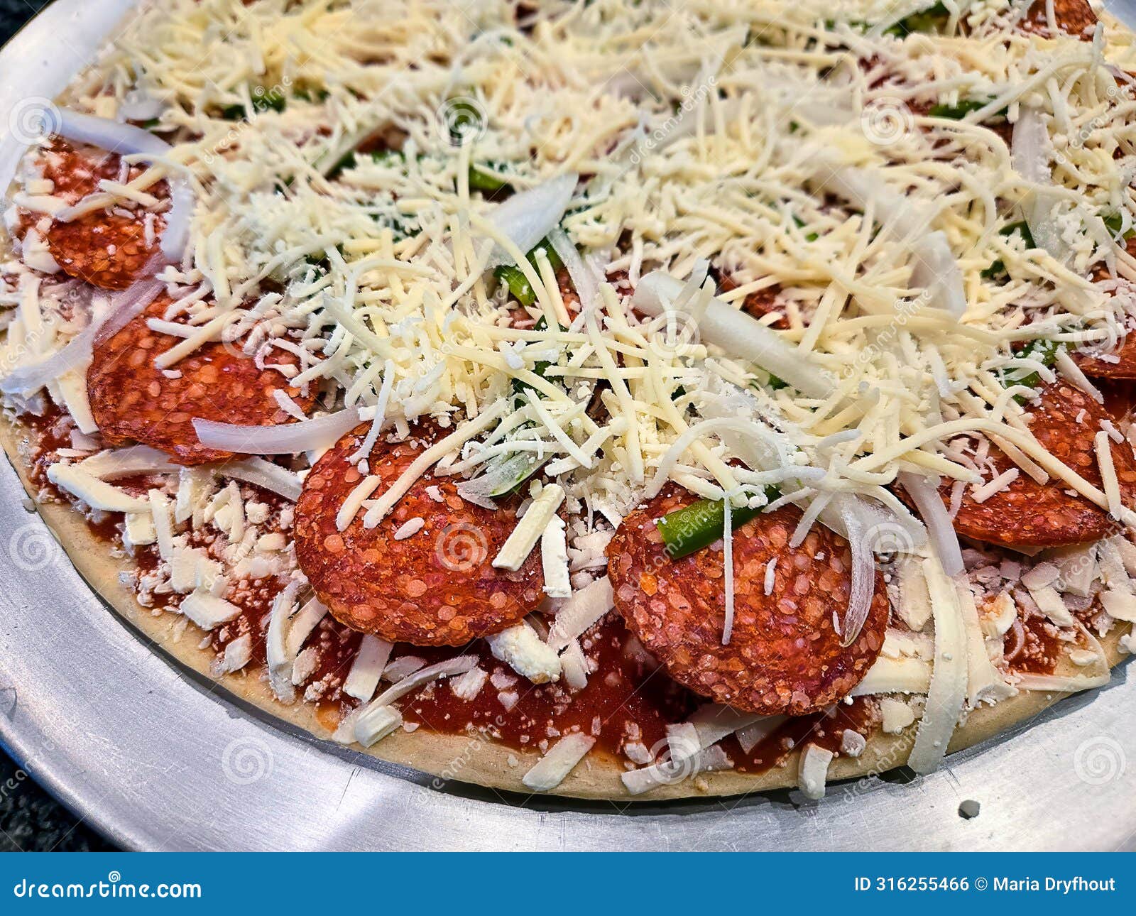 Unbaked Thin Crust Pepperoni Pizza Stock Photo - Image of closeup ...