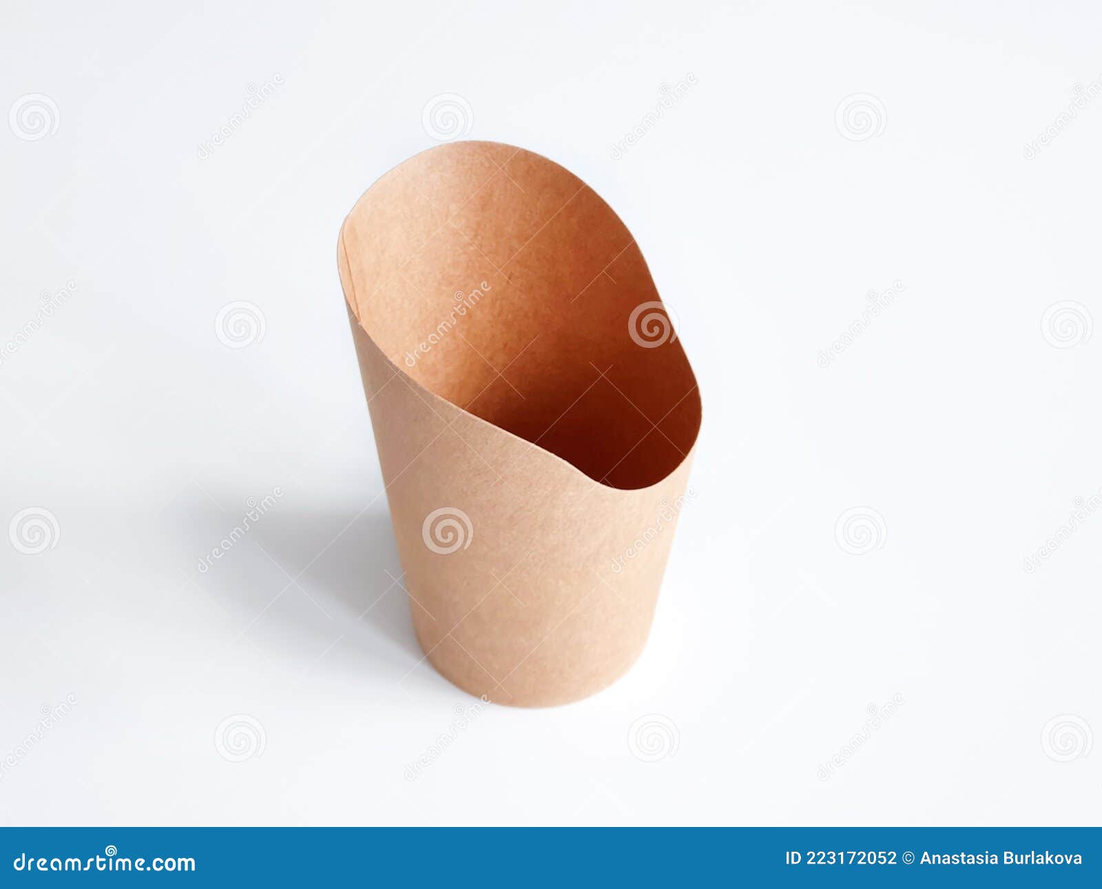 French fries in a brown paper bag isolated on a white background