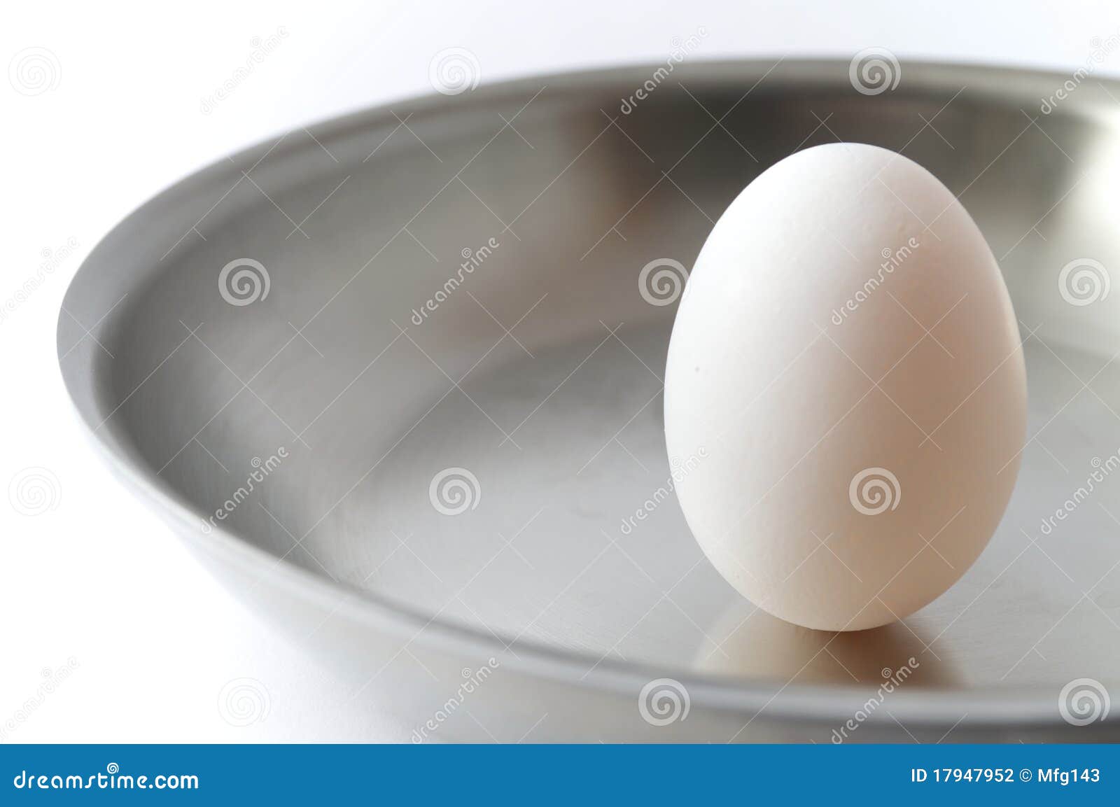 unbroken egg on a pan