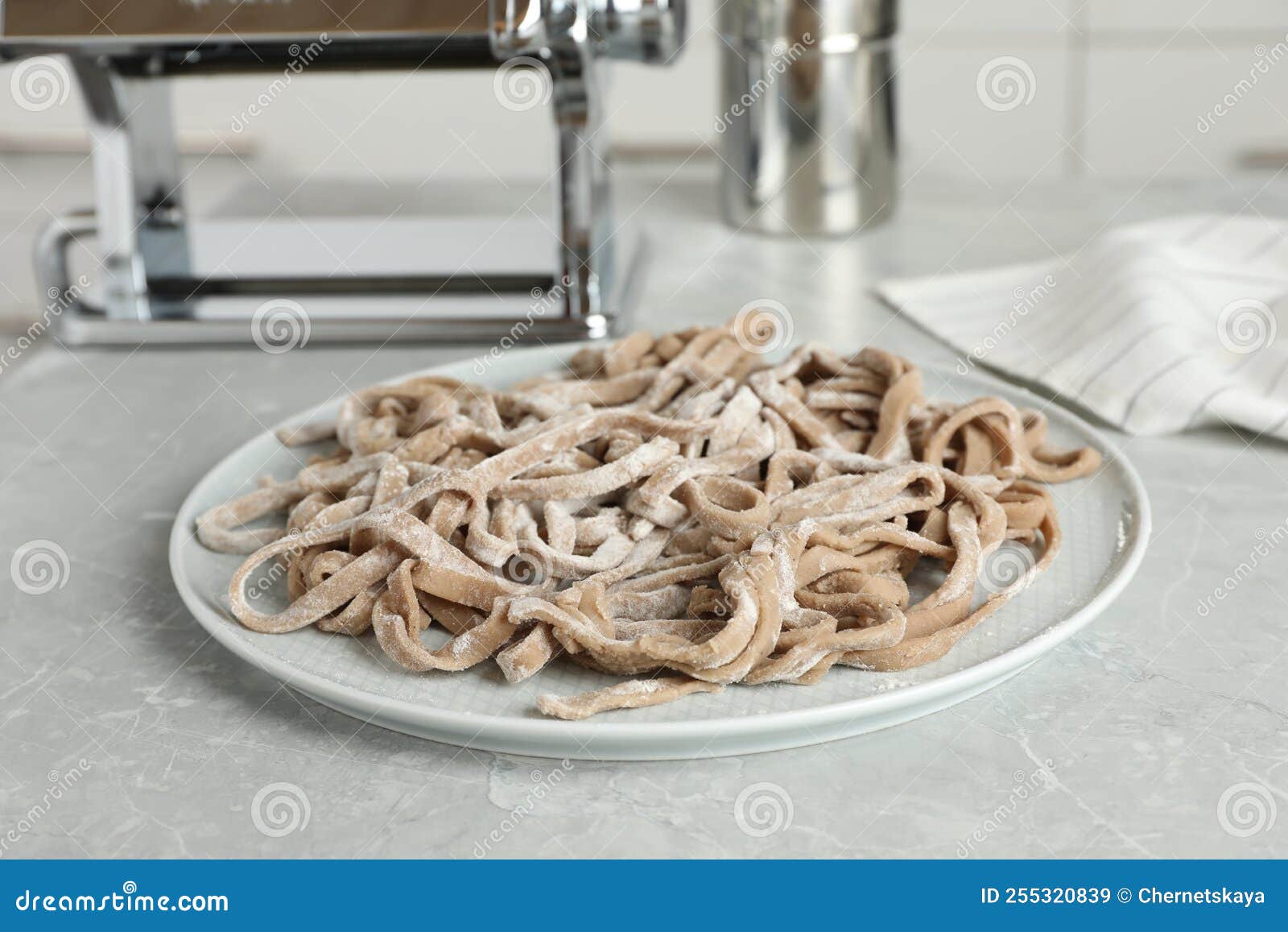 Uncooked Homemade Soba Buckwheat Noodles on Grey Table in Kitchen Stock