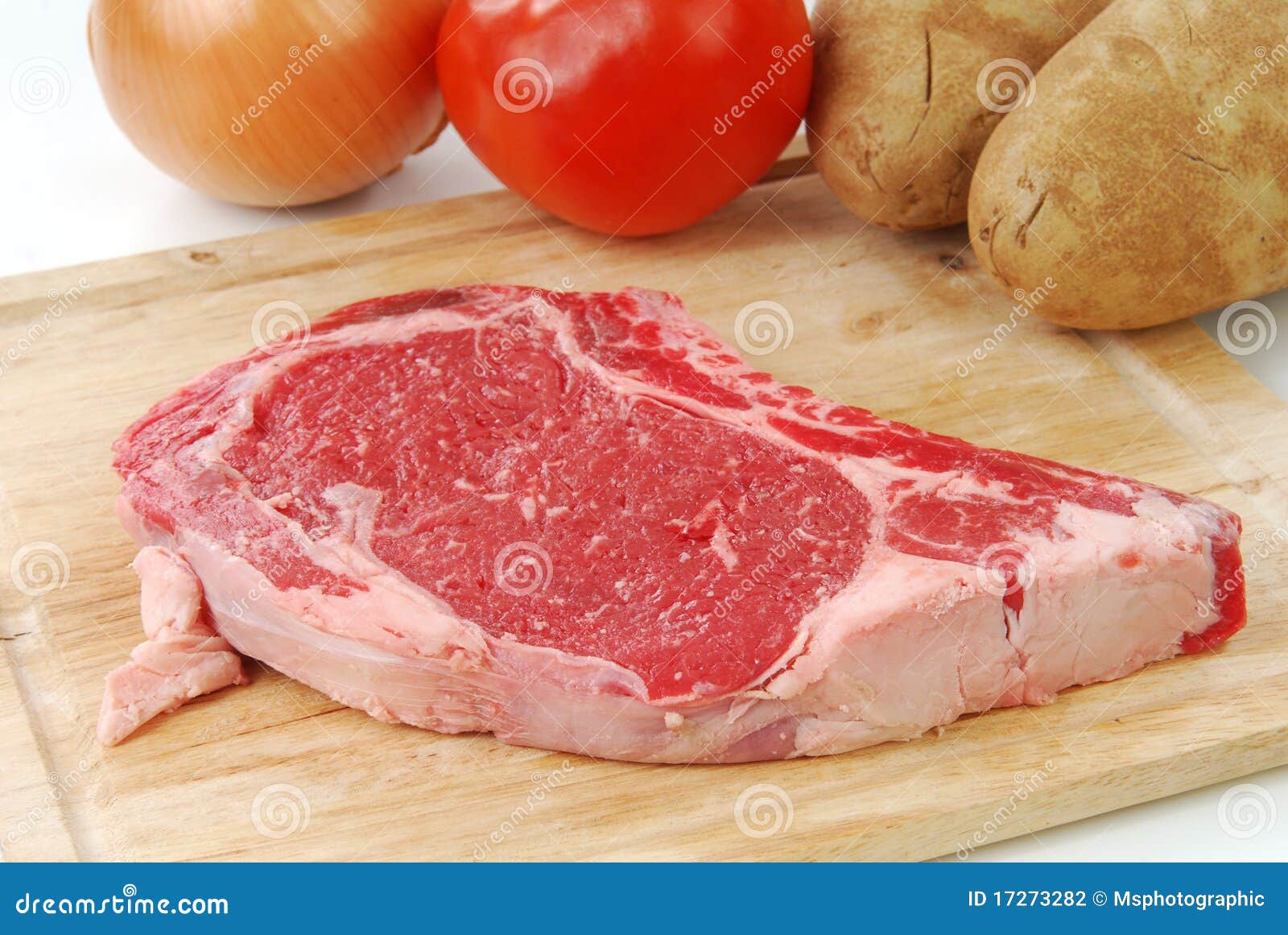 Uncooked rib eye steak stock photo. Image of food, tomato 17273282