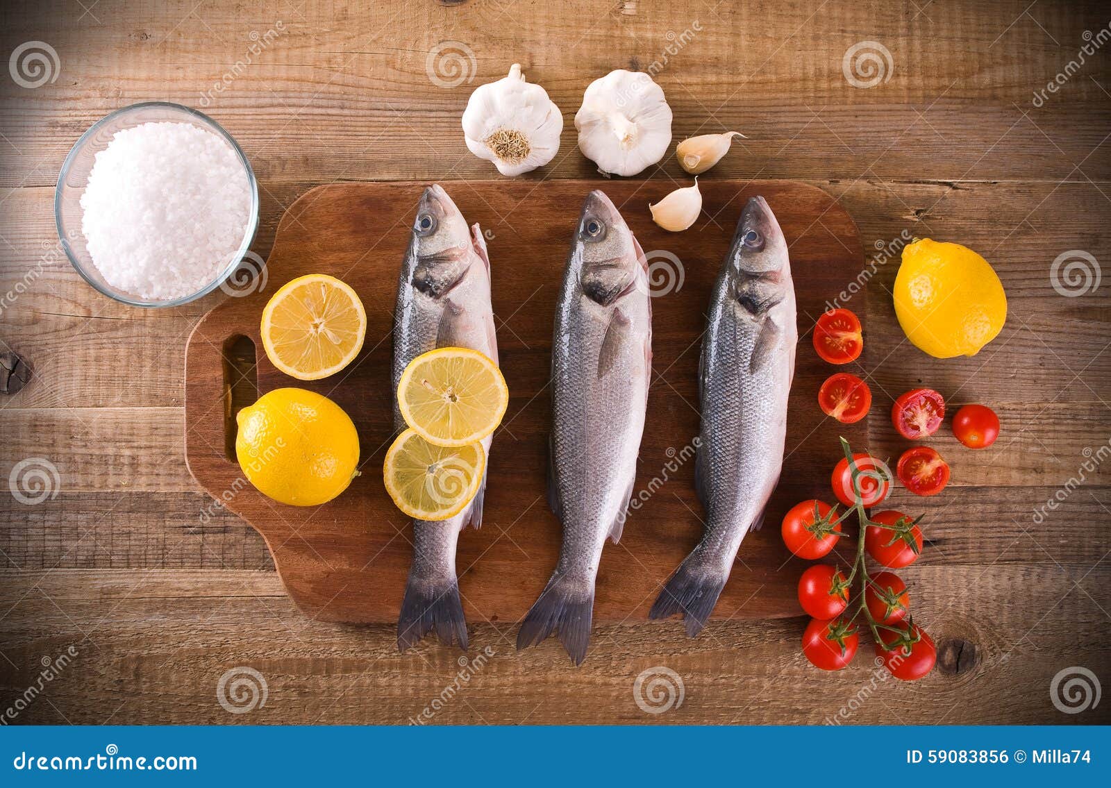 Uncooked sea bass. stock photo. Image of edible, garlic 59083856