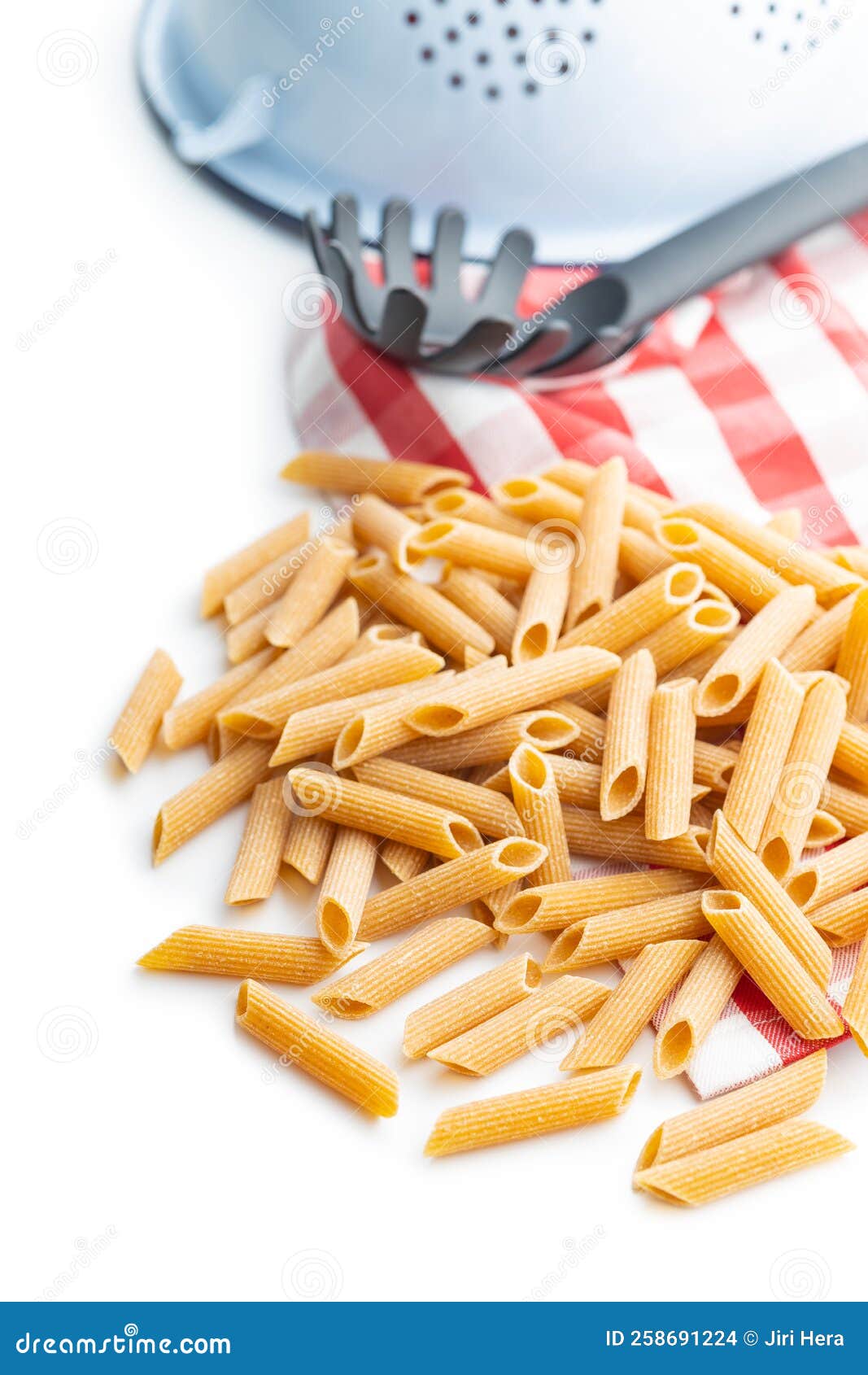 Uncooked Whole Grain Pasta Isolated on White Background. Raw Penne