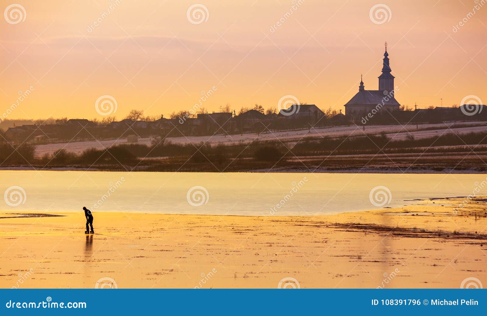undefined person skating on the frozen lake