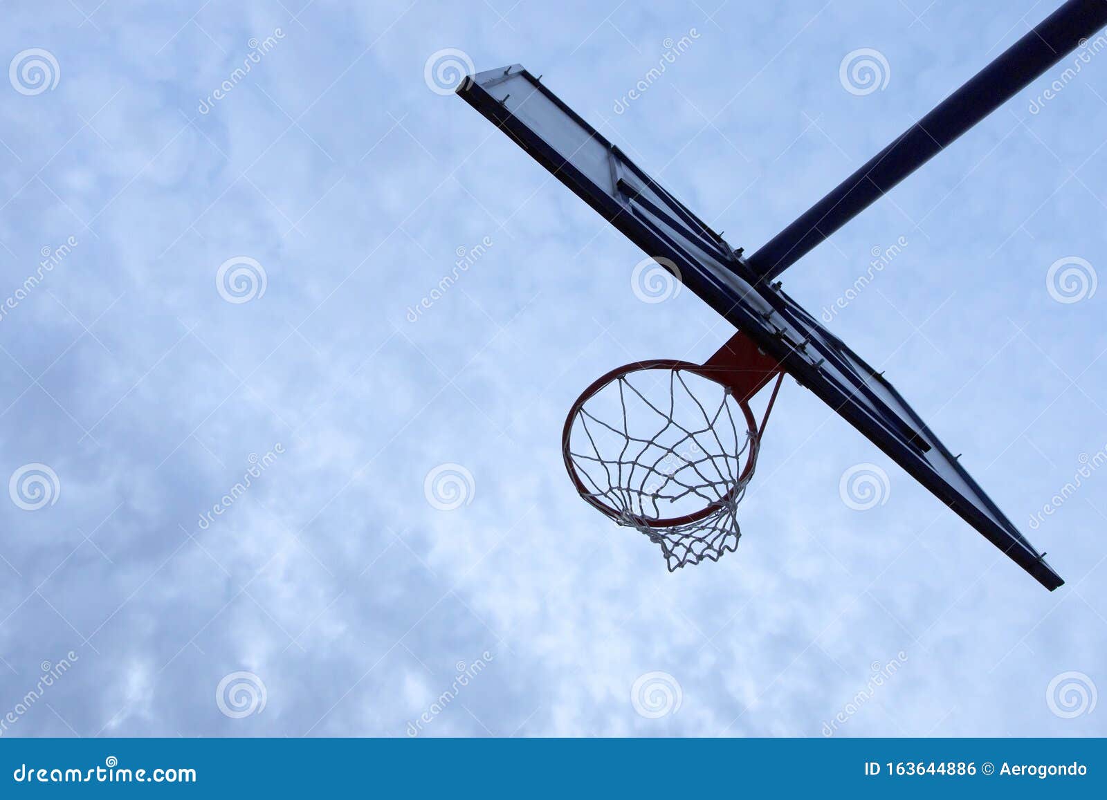 Under a Basketball Hoop with Overcast Day Stock Photo - Image of park,  ball: 163644886