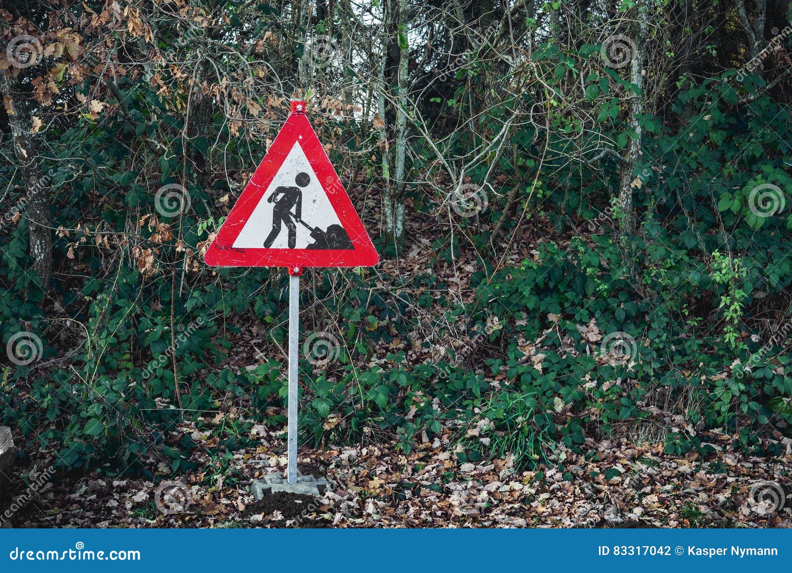 Under Construction Sign with a Digging Worker Stock Photo Image of