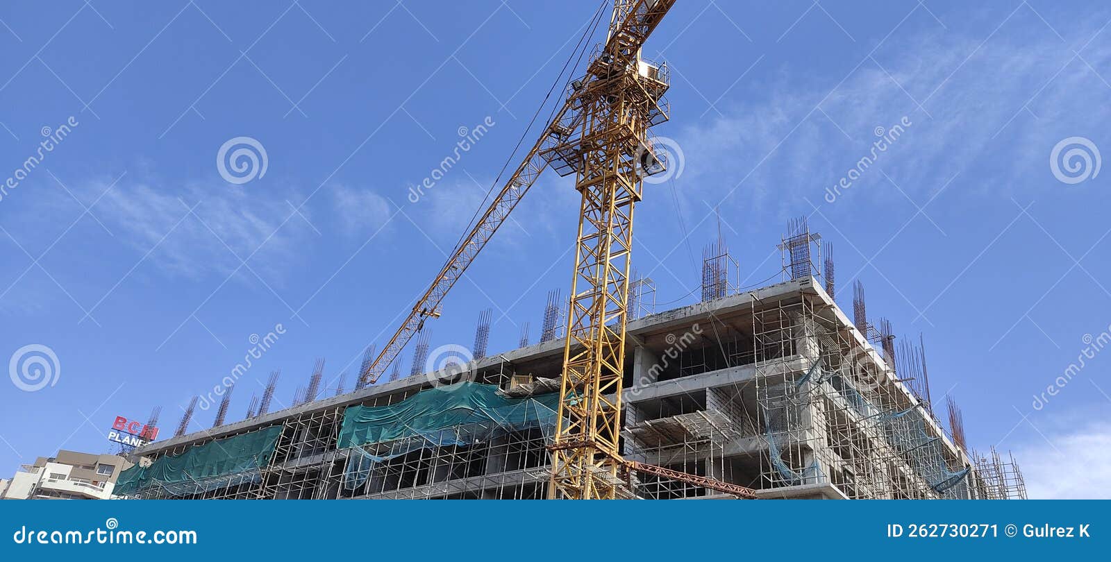 Under Construction Site with Crane and Blue Sky Background Stock Image