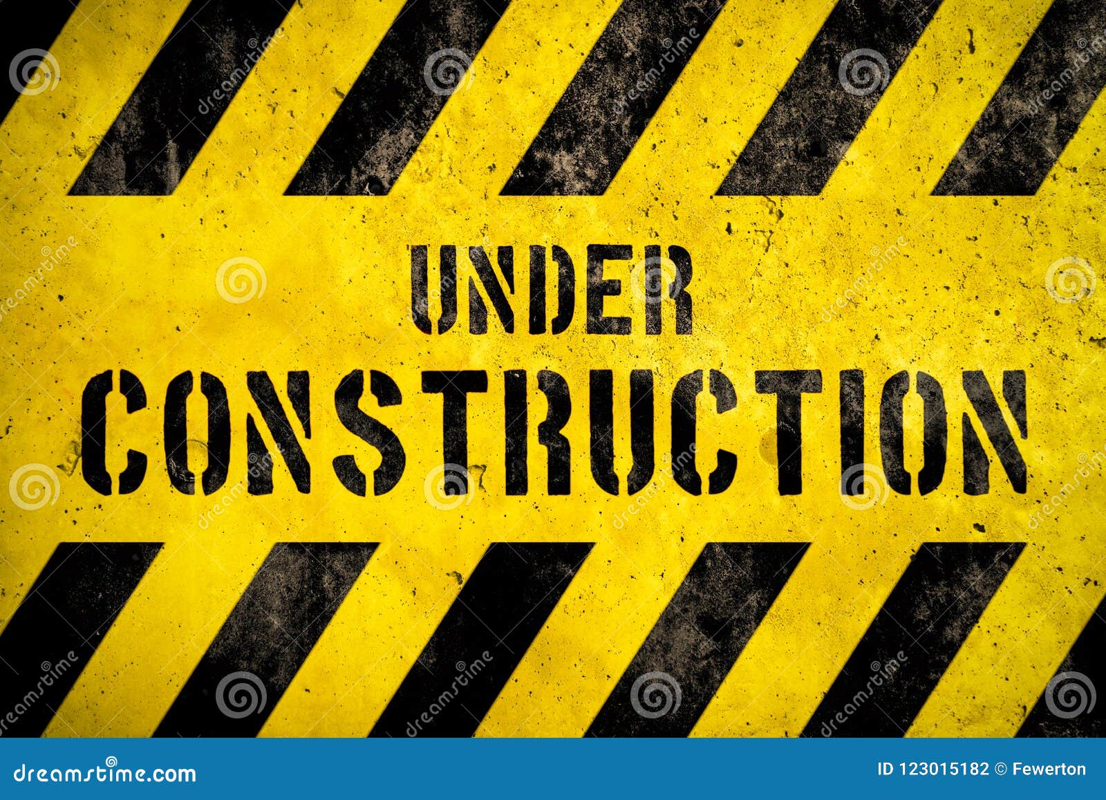 Under Construction Warning Sign Text with Yellow Black Stripes Painted ...