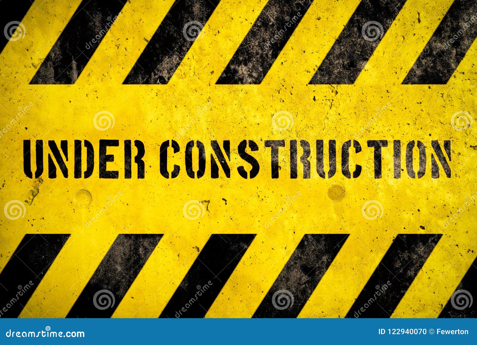 Under Construction Warning Sign Text with Yellow Black Stripes Painted ...