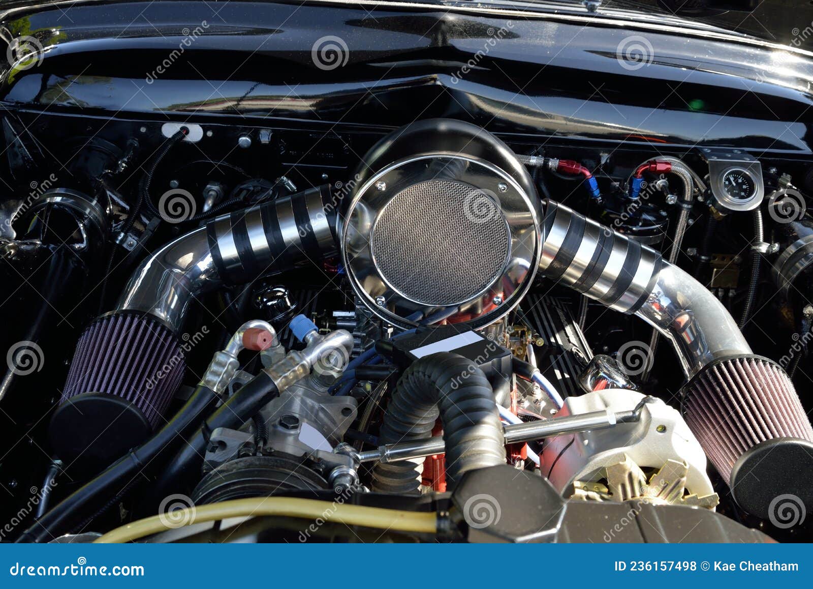 AUTOMOTIVE Under the Hood View of a Dual Carb Engine Stock Photo