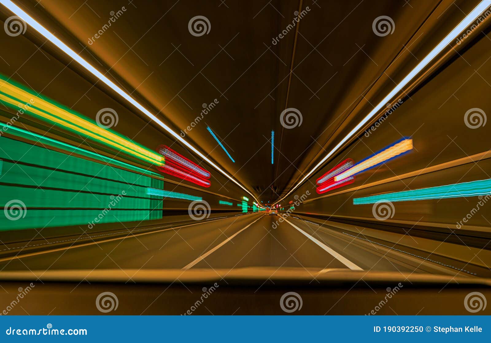 Underground Car Tunnel with Light Trails and Leading Lines. Stock Photo