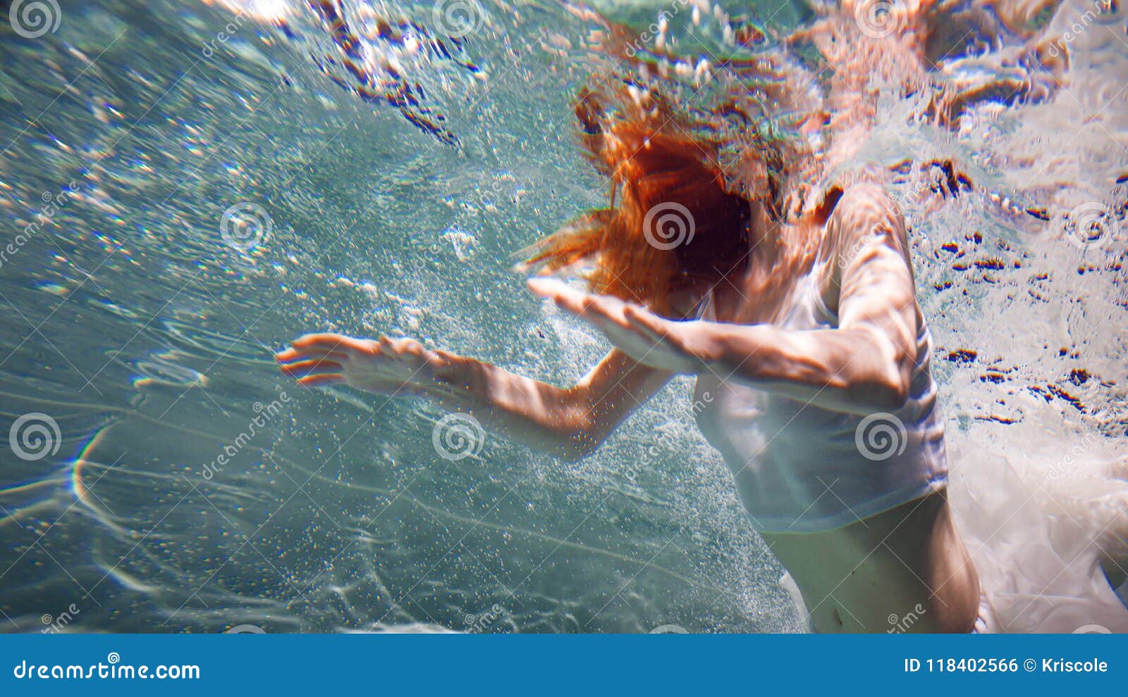 Underwater Girl. Beautiful Red-haired Woman in a White Dress, Swimming ...