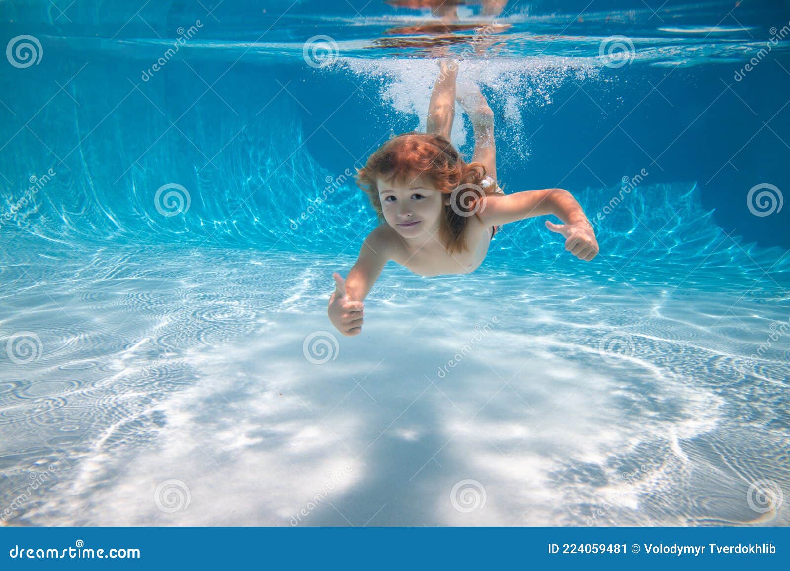 Underwater Kid Boy Swim Under Water in Swimming Pool. Stock Image