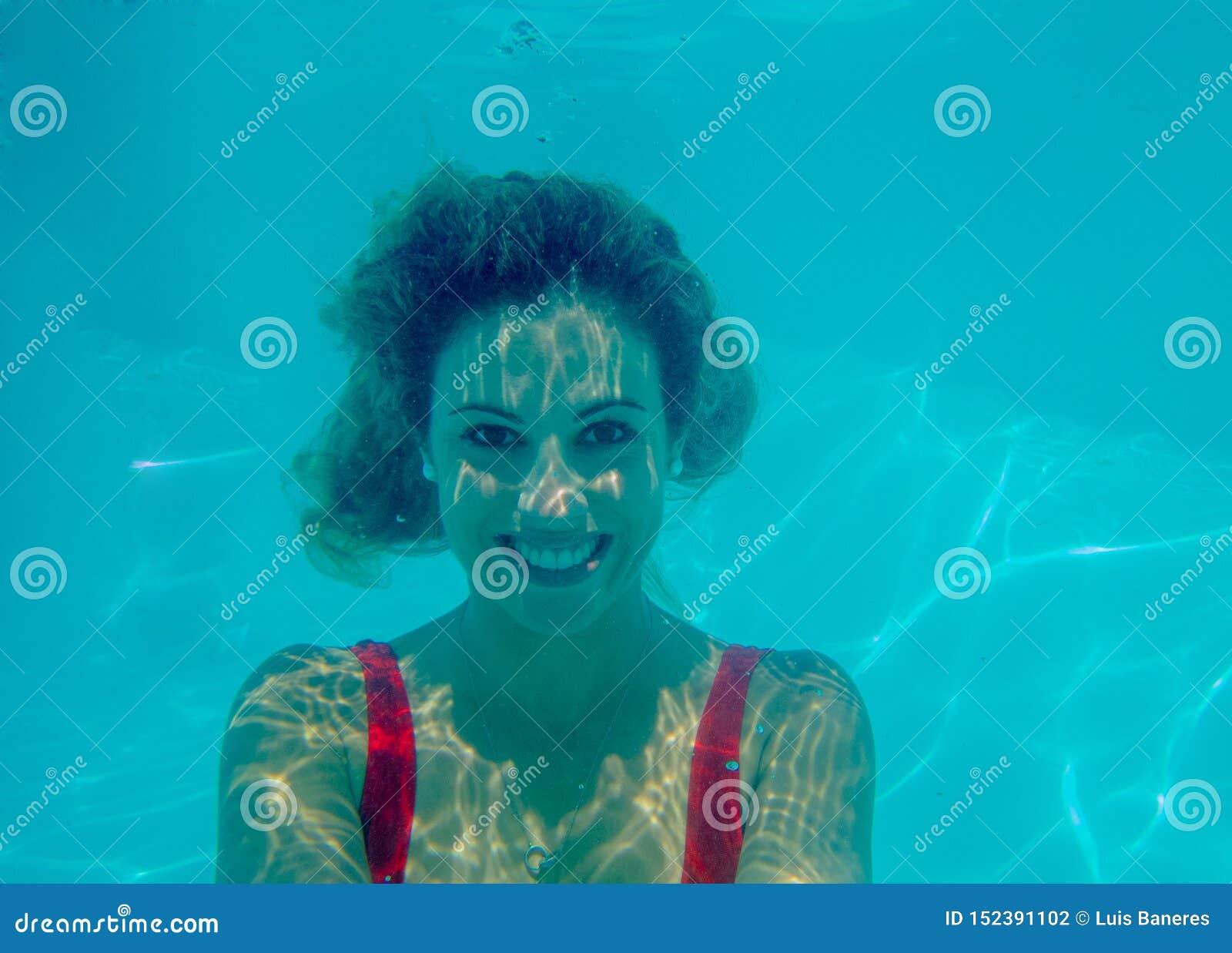 Underwater Photograph of Blonde Girl with Curls and Red Swimsuit Stock ...