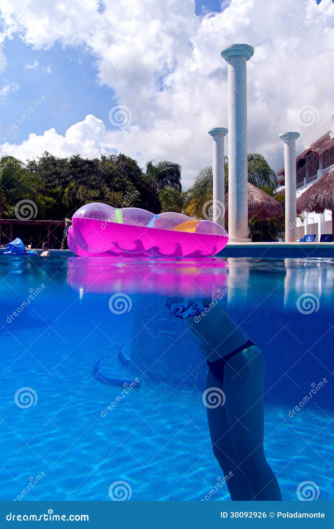 a girl in a swimming pool at playa del carmen, mexico