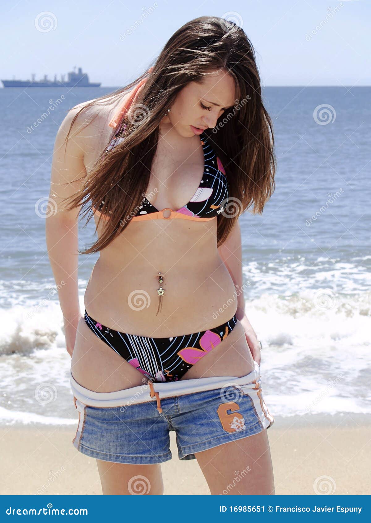 Undressing the Skirt at the Beach Stock Image
