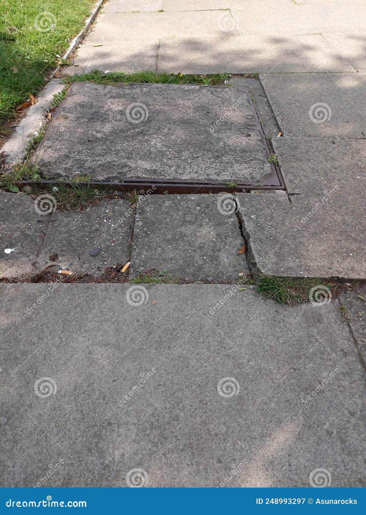 Uneven Paving Slabs and Drain Cover on Pavement Stock Image Image of