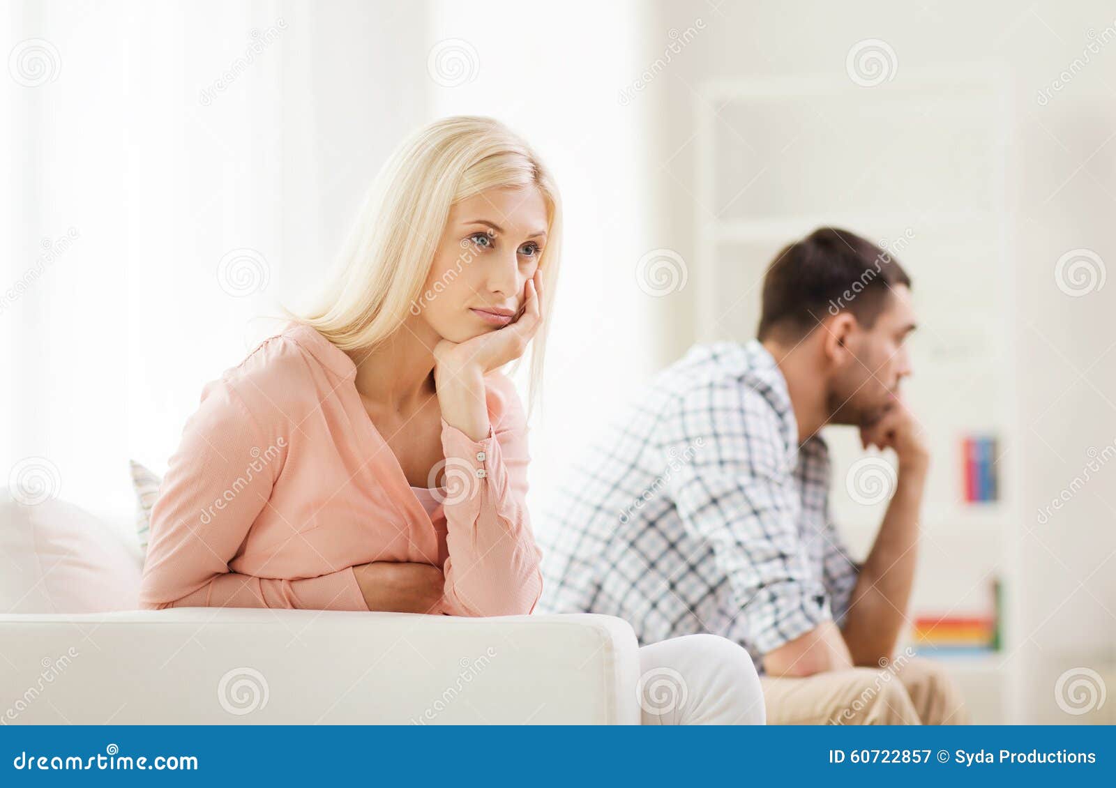 unhappy couple having argument at home