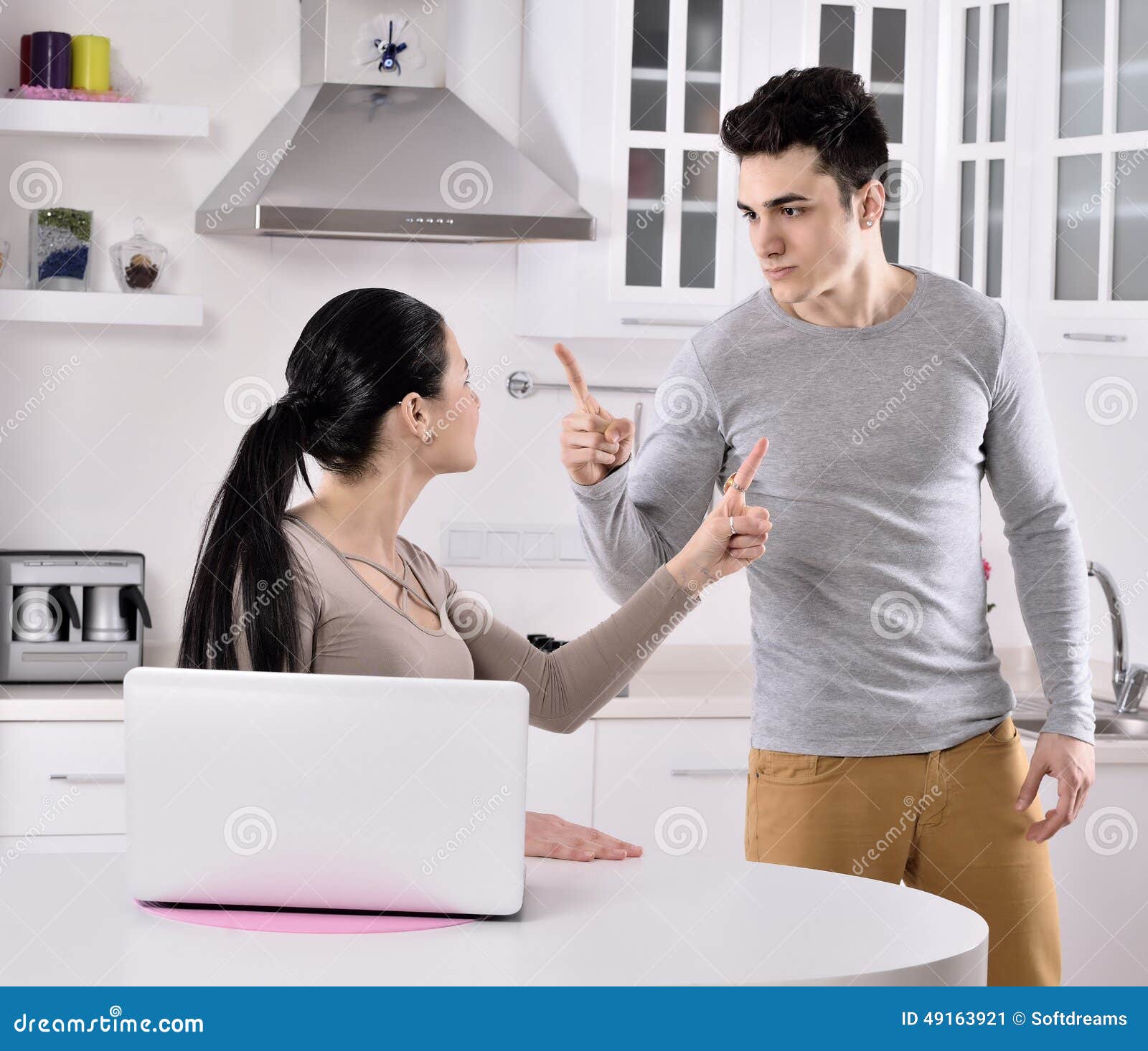 unhappy couple in the kitchen