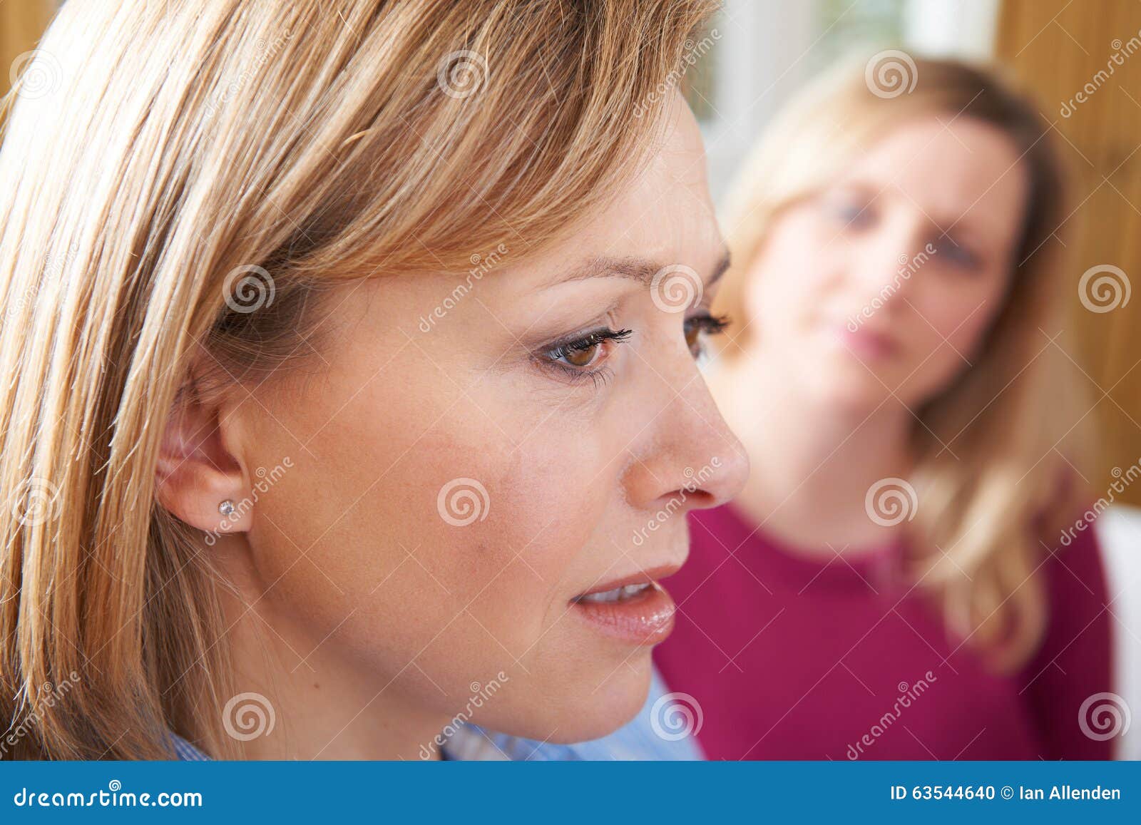 unhappy woman in conversation with friend or counsellor