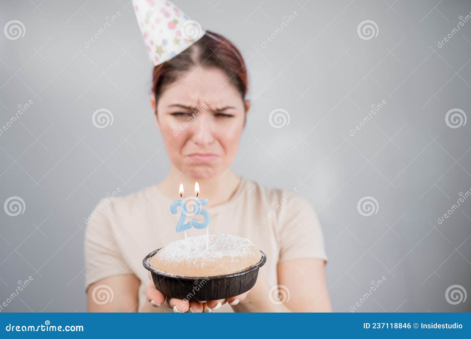 The Unhappy Woman Is Holding A Cake With Candles For Her 25th Birthday The Girl Is Crying On