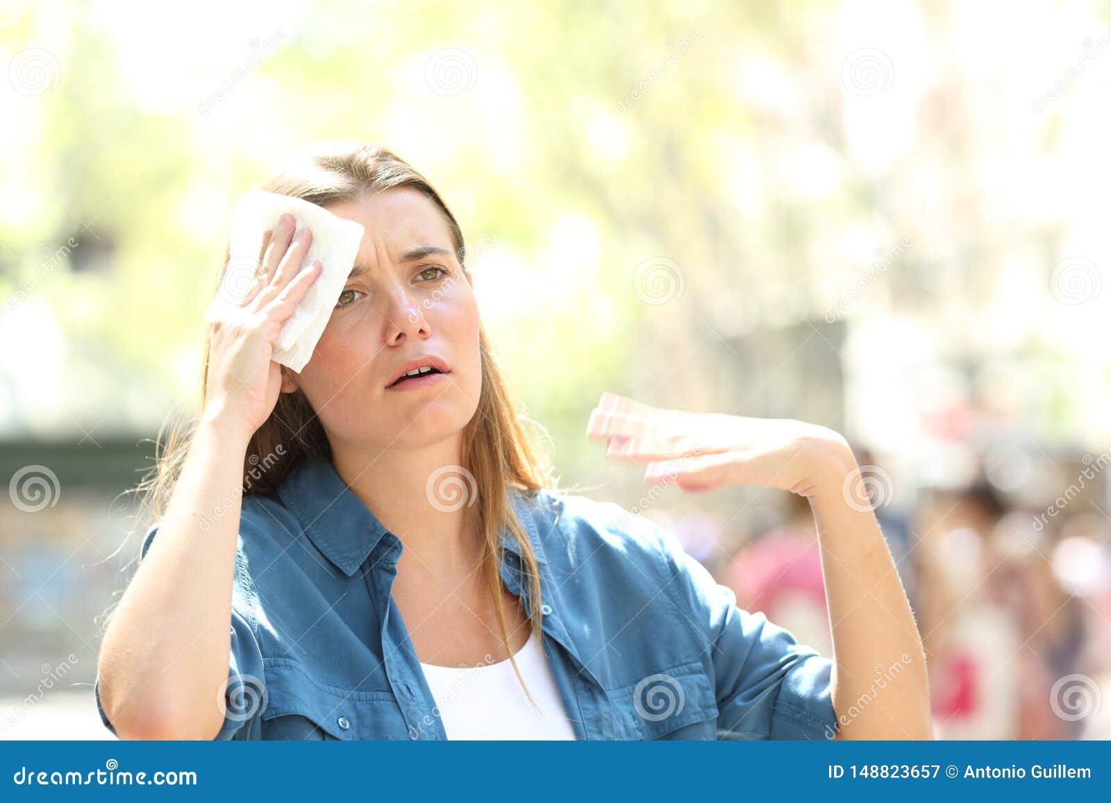 unhappy woman sweating suffering a heat stroke