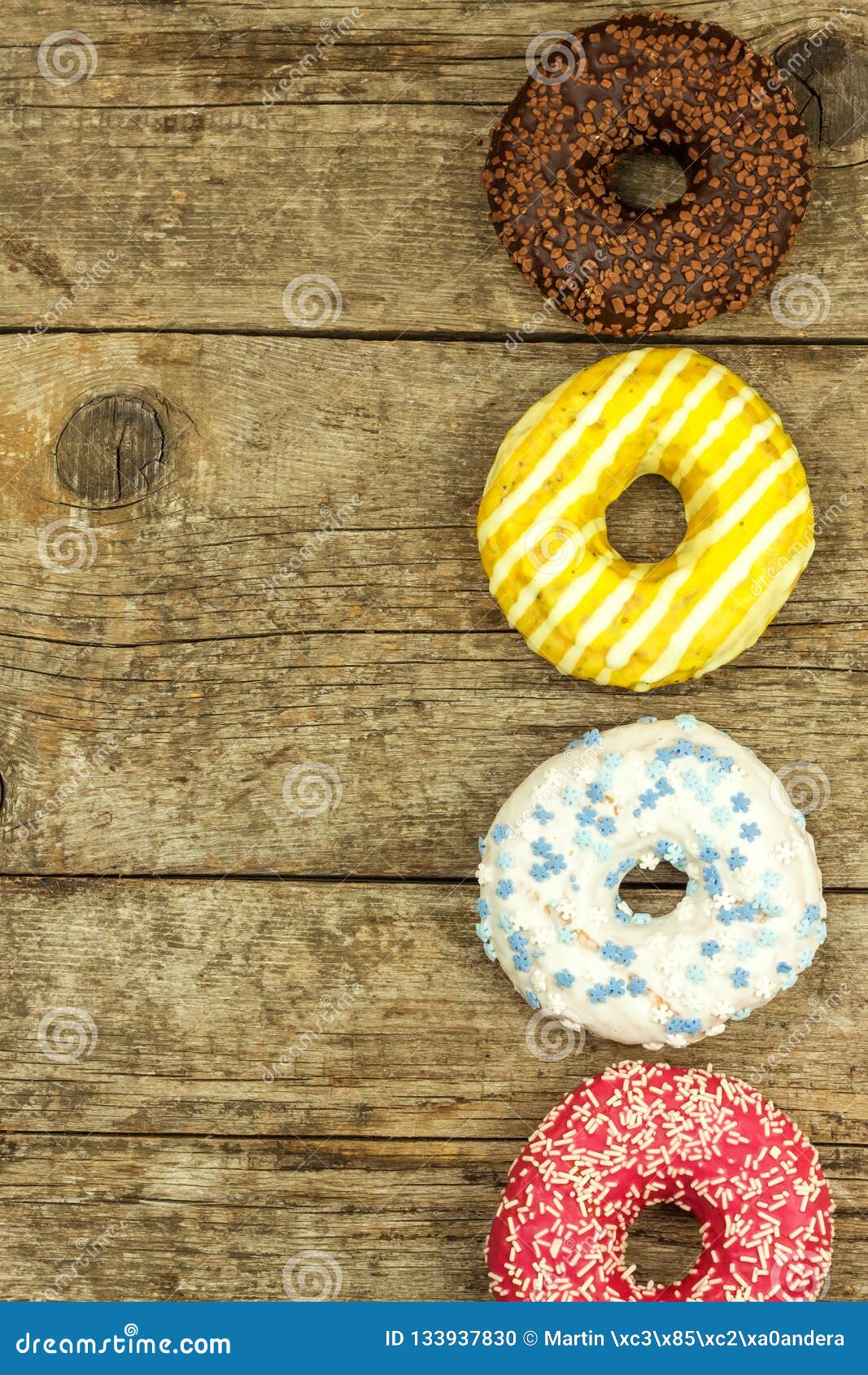 unhealthy-food-donuts-on-a-wooden-table-dangers-of-obesity-and-diabetes-sales-of-sweets-stock