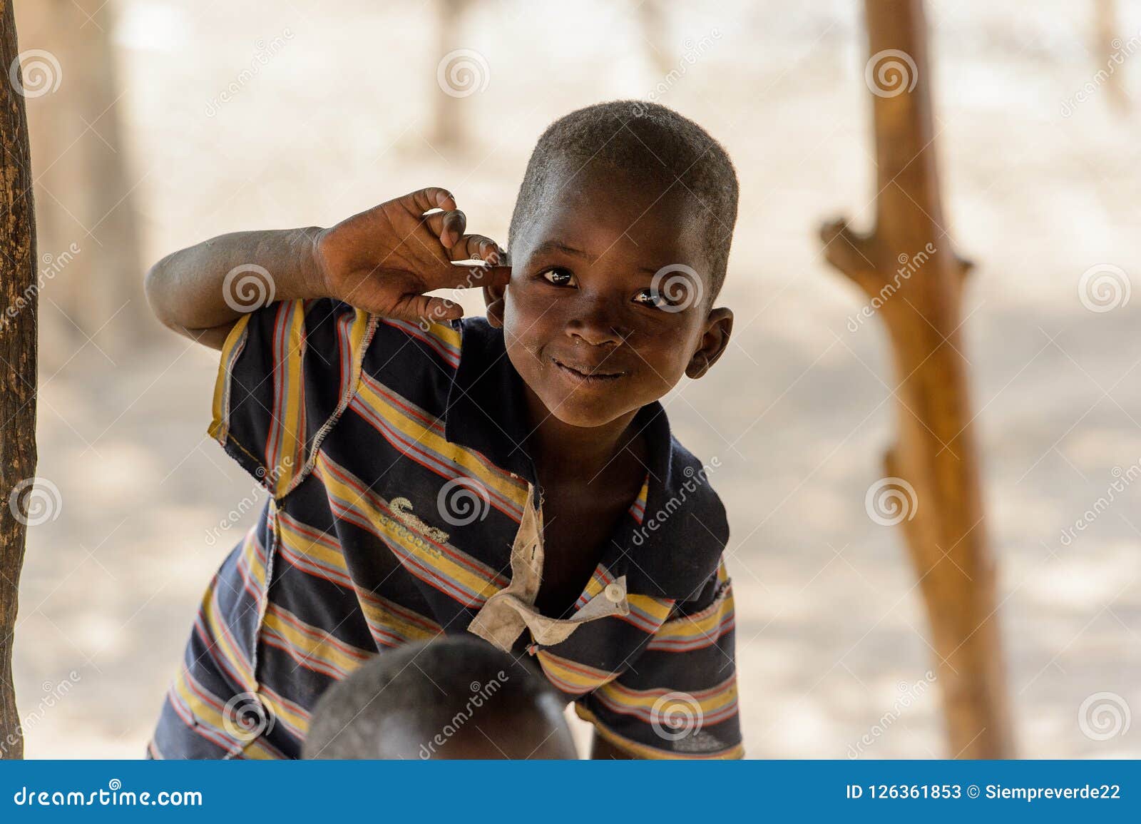 Unidentified Ghanaian Boy in Striped Shirt Smiles in the Ghani ...