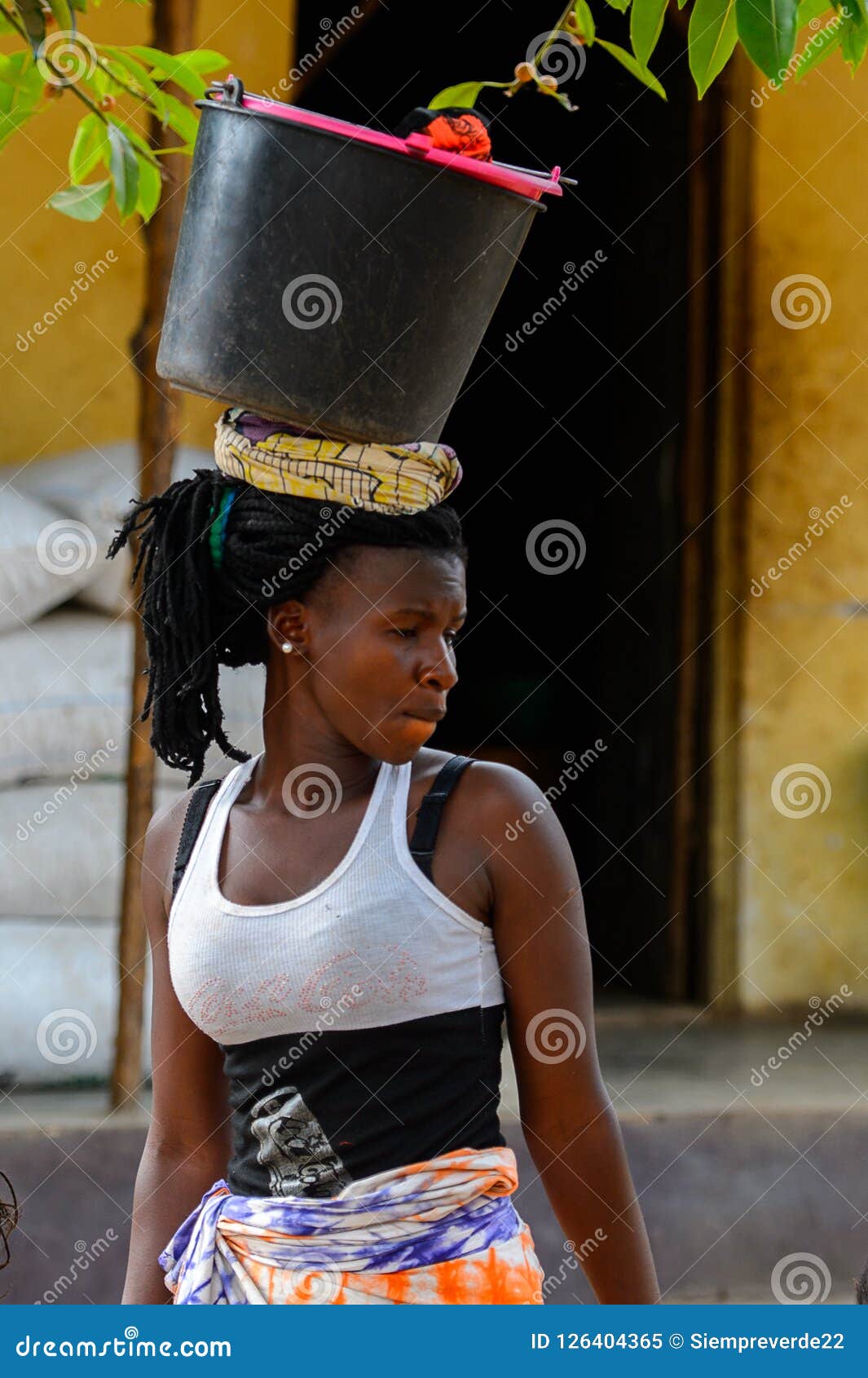 Unidentified Local Woman Carries A Bucket On Her Head In A Vill Editorial Image Image Of