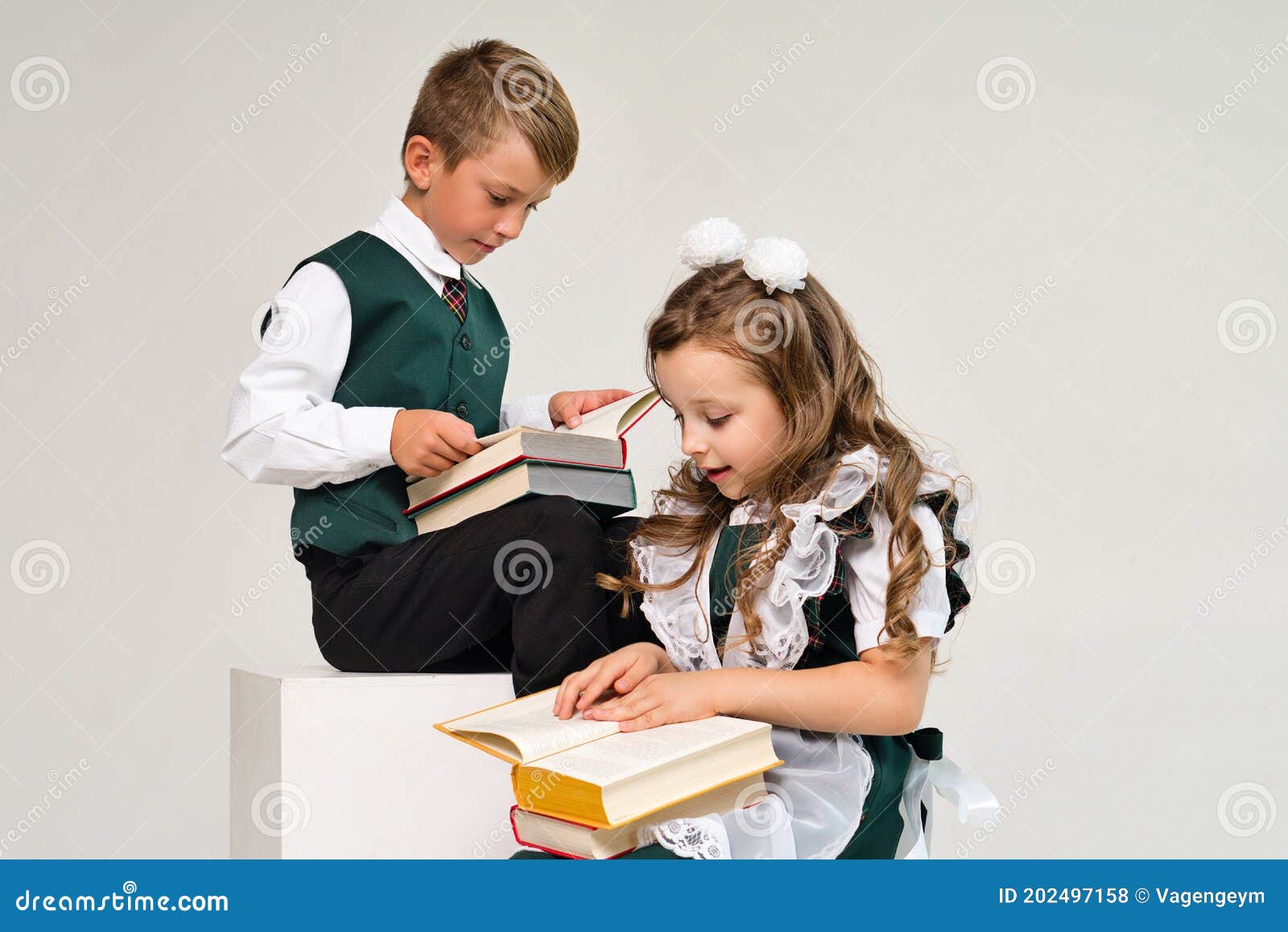Schoolchildren in uniform stock photo. Image of book 202497158