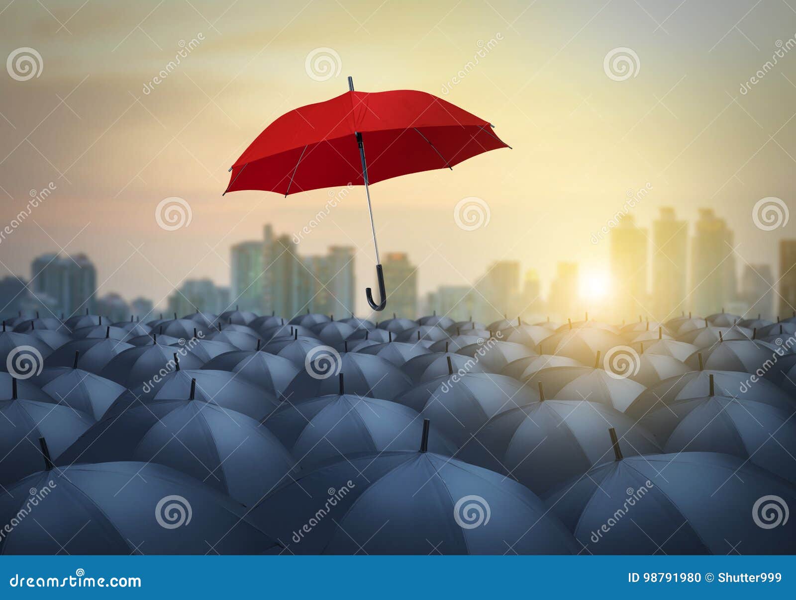 unique red umbrella among black umbrellas