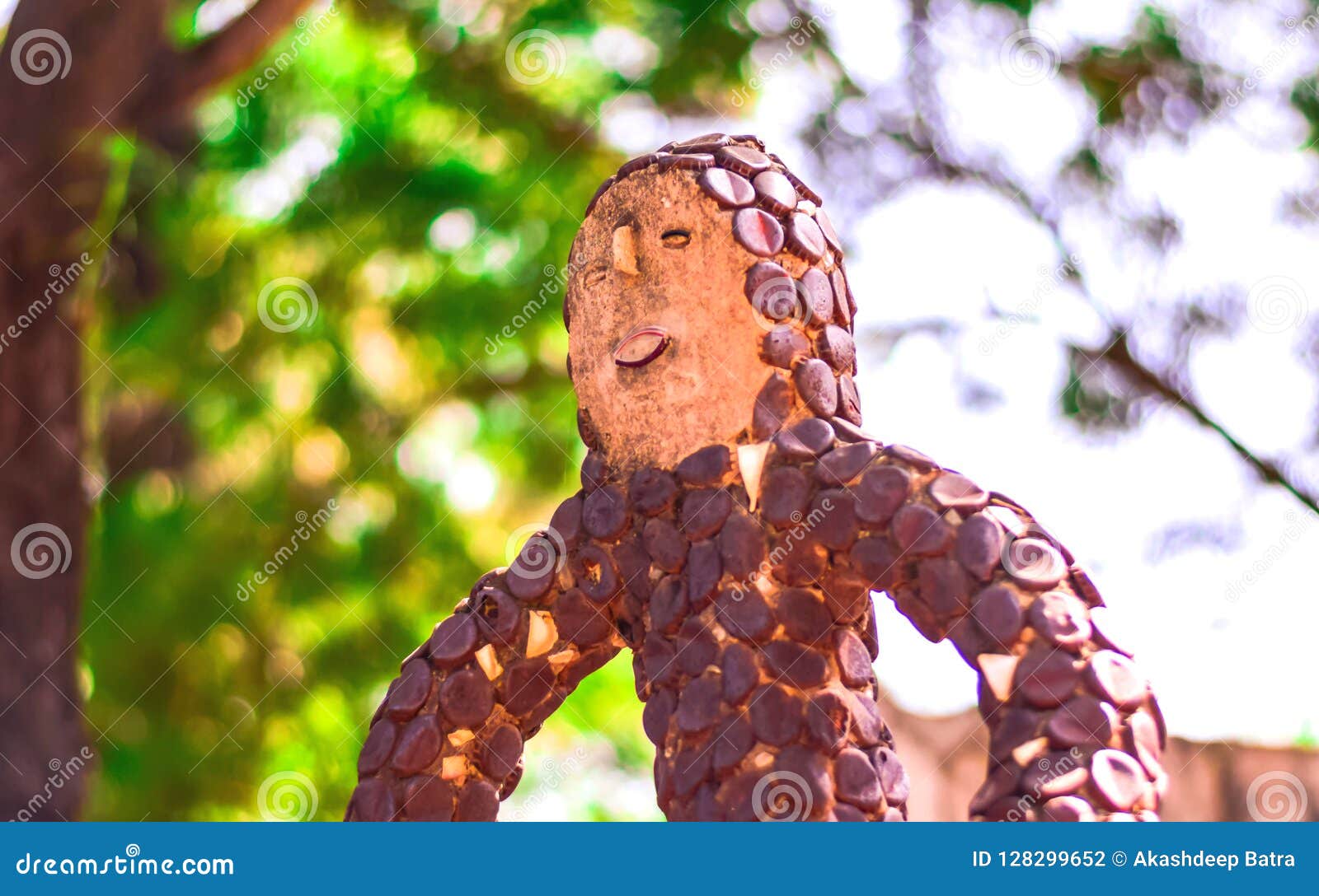 UNIQUE STATUE of BOY MADE with COL DRINK CAPS Stock Photo Image of
