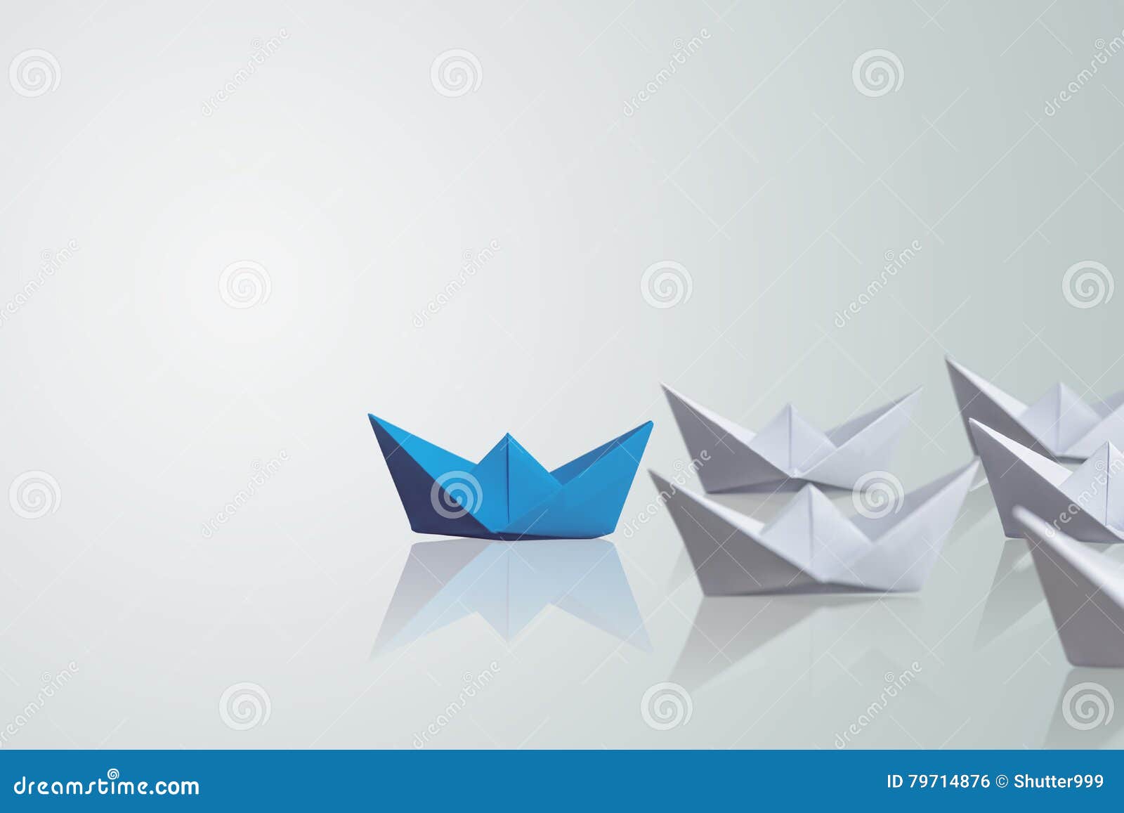 Uniqueness concept, paper boat outstanding from the others