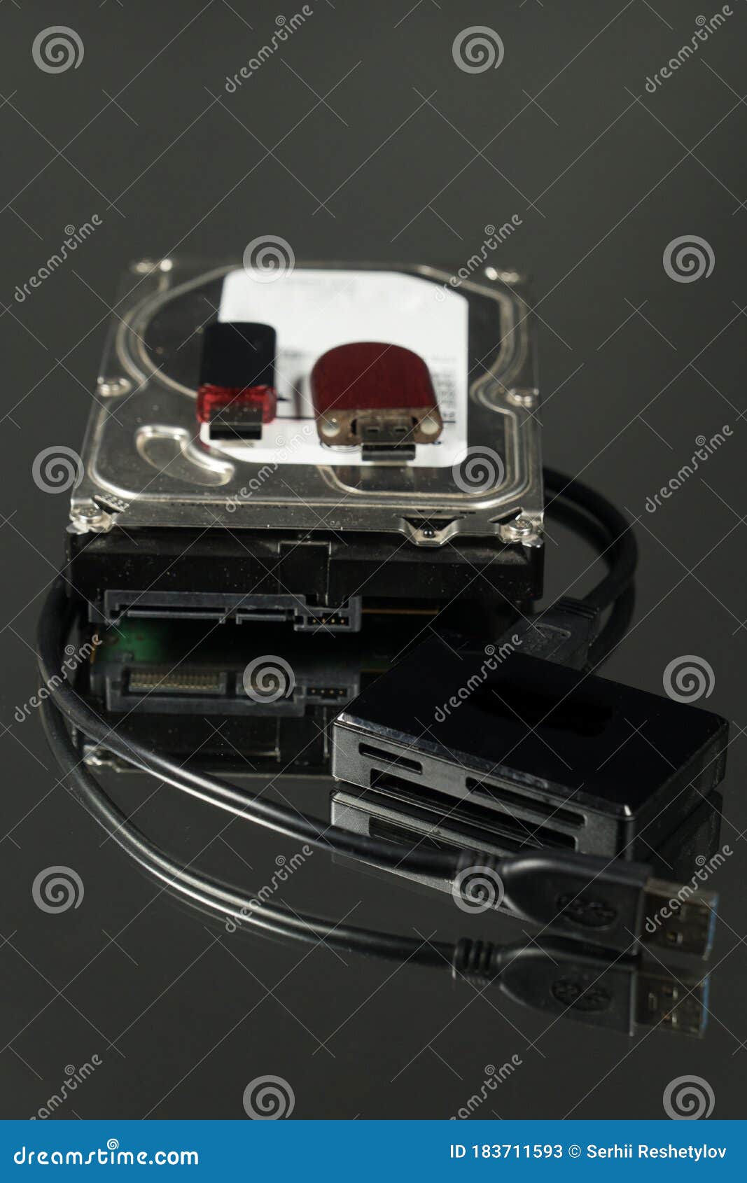 Universal Card Reader and Hard Drive Isolated on Black Background Stock