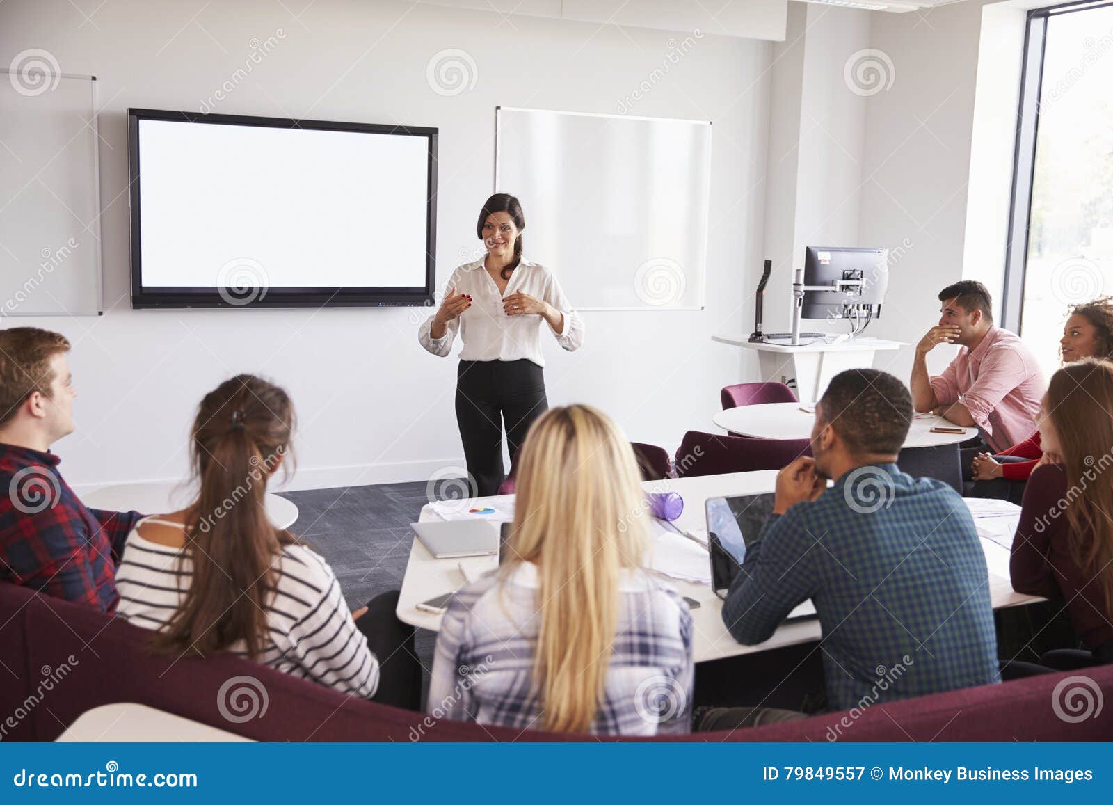 university students attending lecture on campus