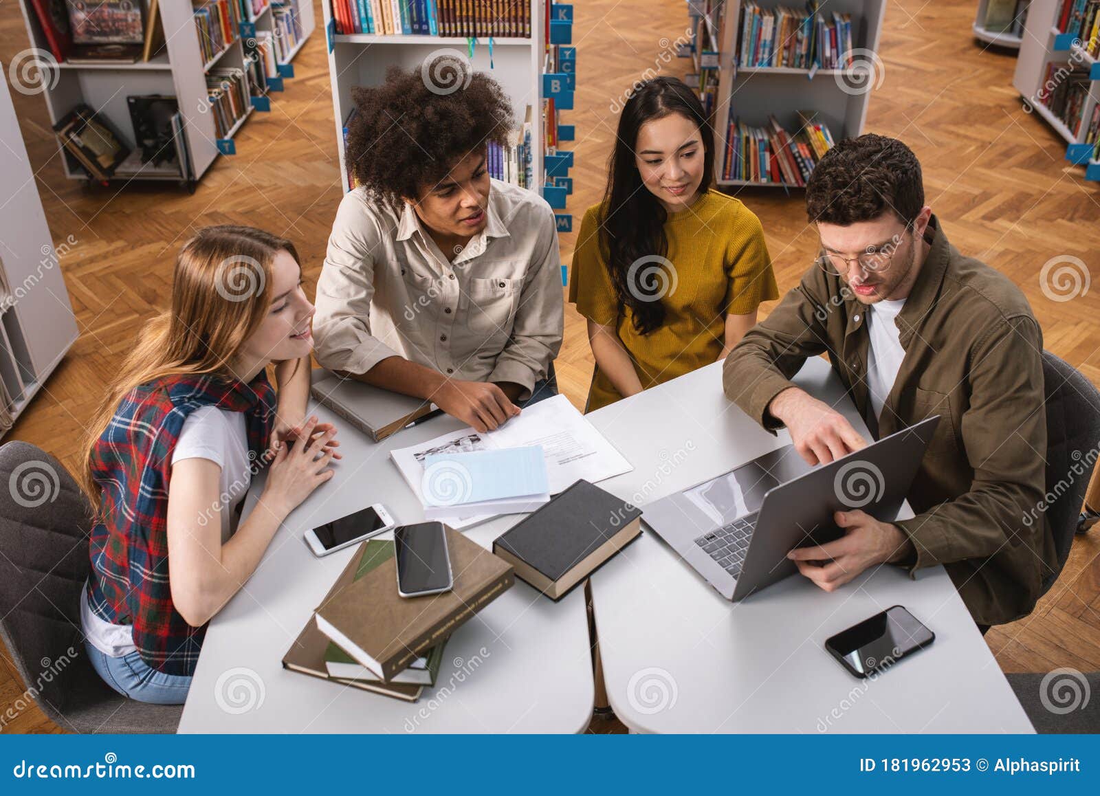 University Students Are Studying In A Library Together