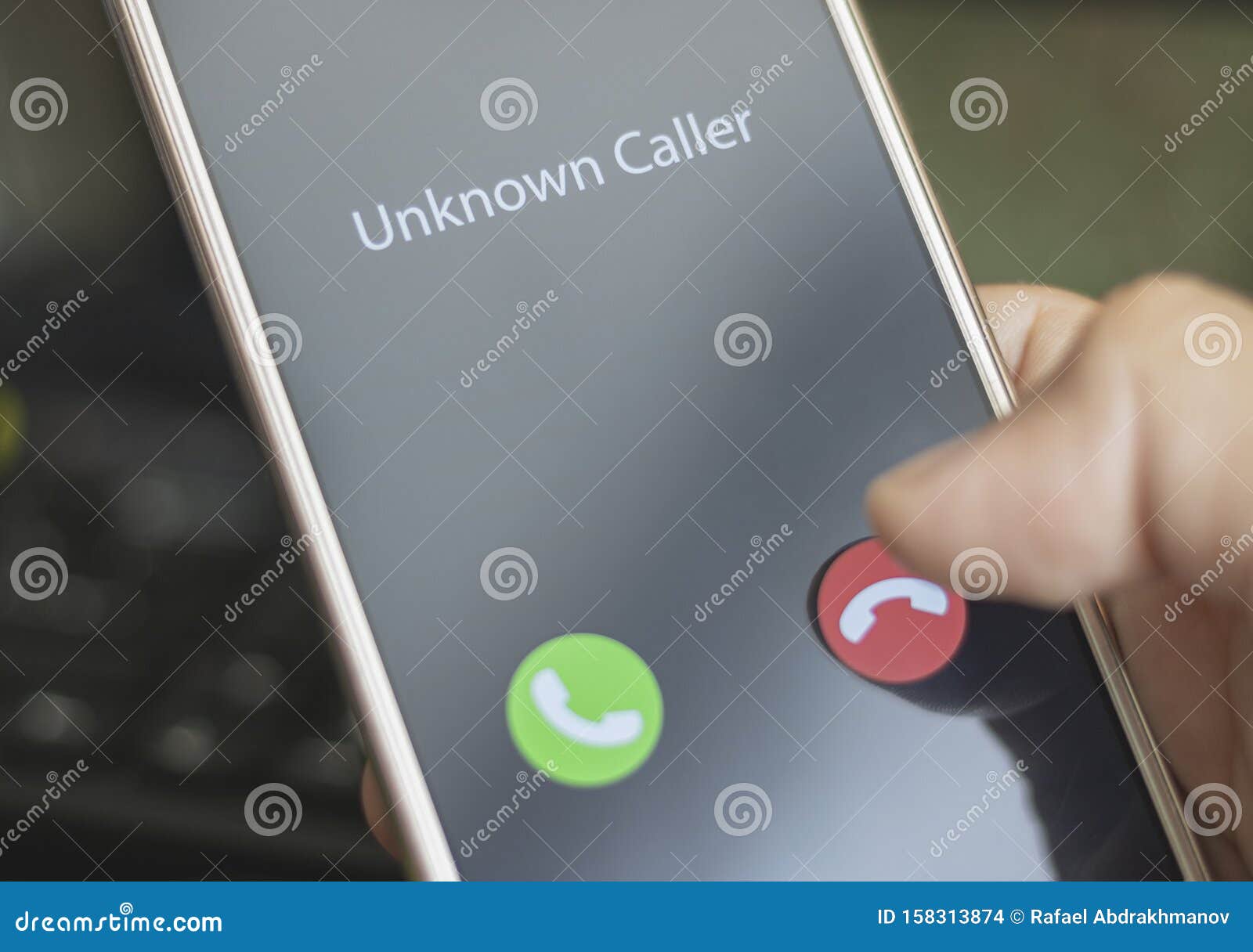 Unknown Caller. a Man Holds a Phone in His Hand and Thinks To End the