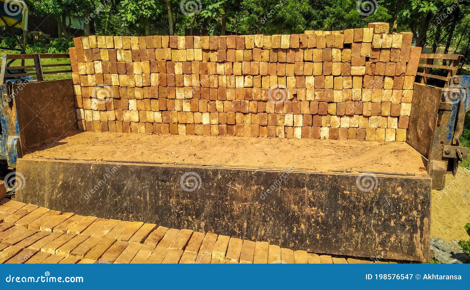 Unloading the Loaded Bricks on the Tractor Trolley. Stock Image Image