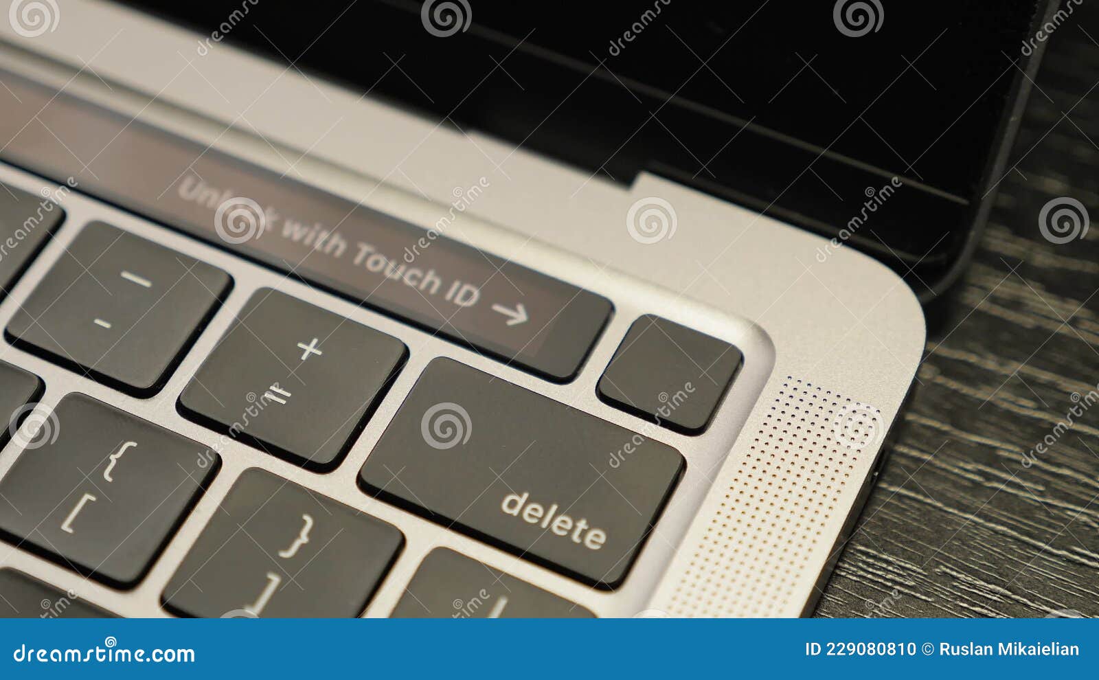Unlocking Computer with Fingerprint Sensor. Touch ID on Laptop Stock