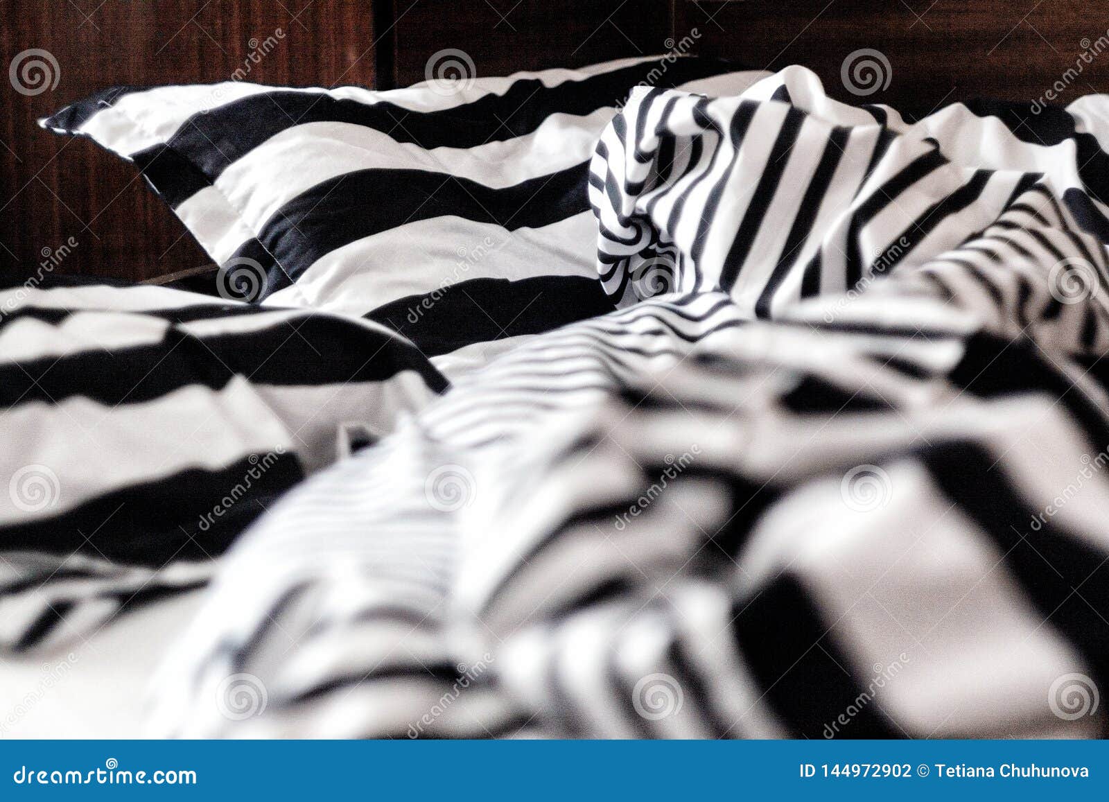 Unmade Bed in Black and White Stripes. Closeup Stock Photo Image of comfort, cover 144972902