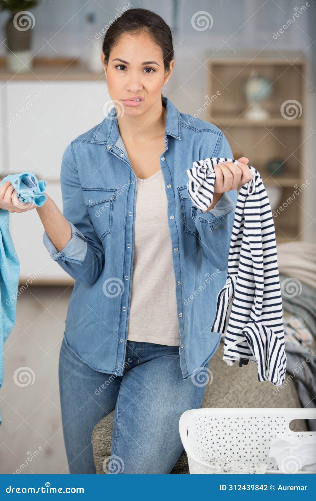 unmotivated woman borde doing laundry